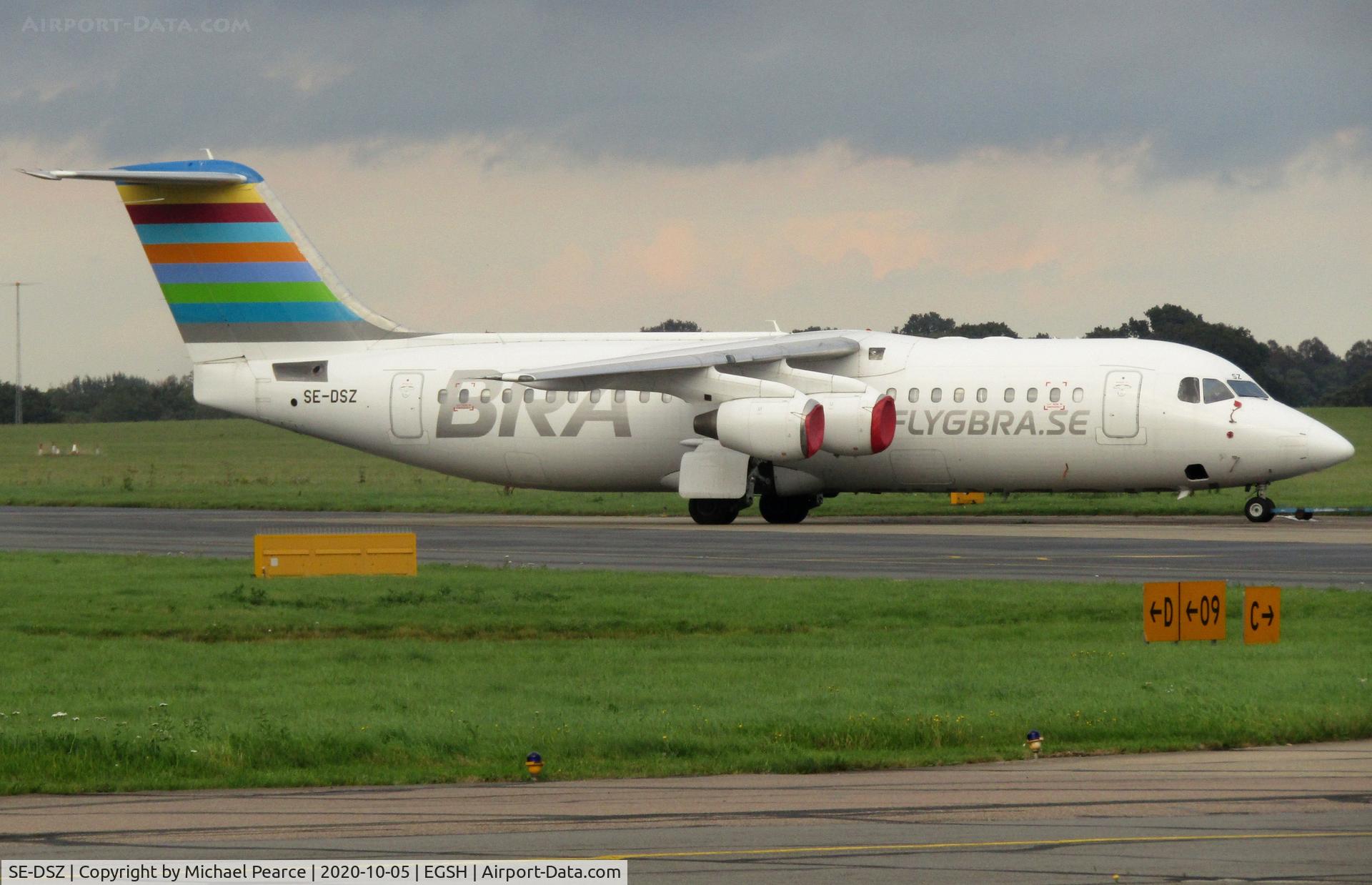 SE-DSZ, 2000 British Aerospace Avro 146-RJ100 C/N E3380, Under tow from North Side to Stand 7 for work during storage.