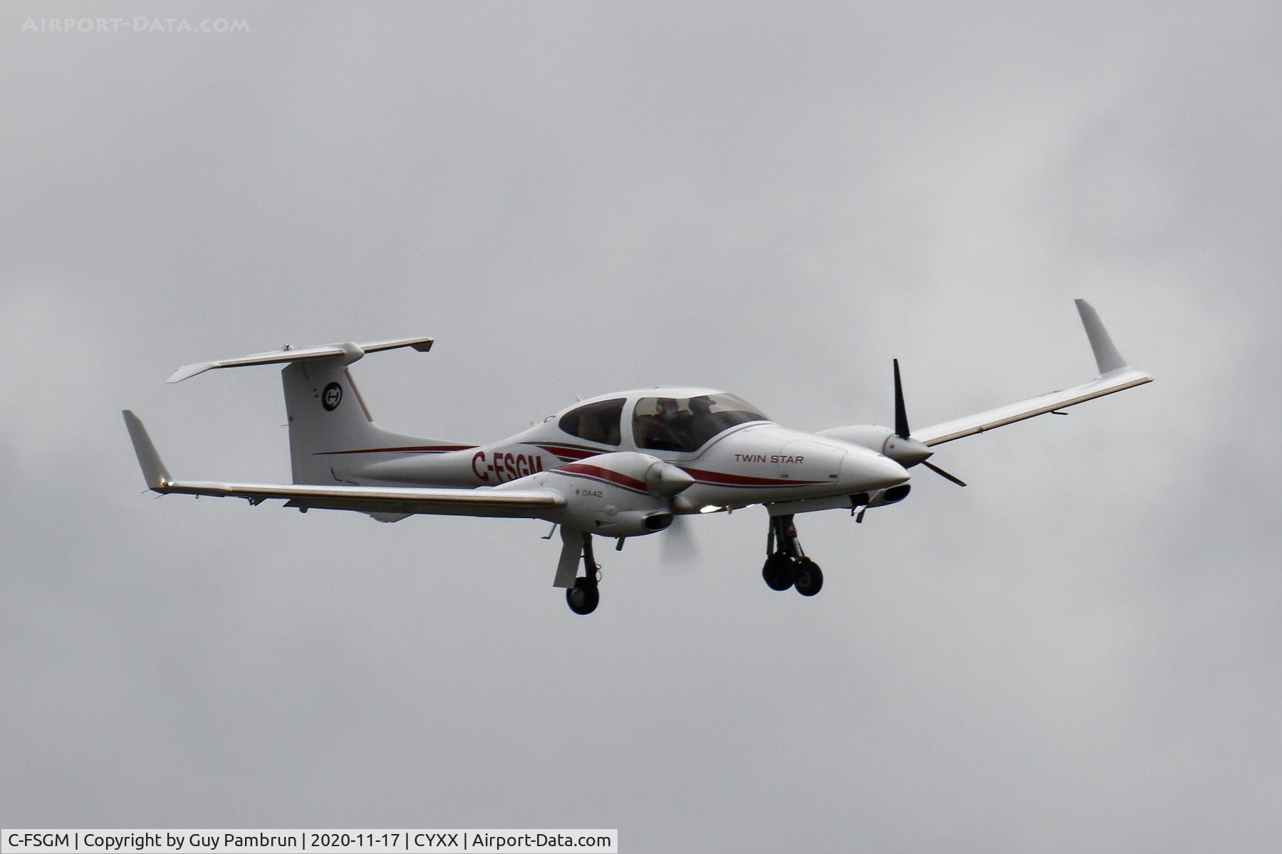 C-FSGM, 2006 Diamond DA-42 Twin Star C/N 42.105, On final for 19 with and engine out. Winds gusting a bit over 60kph at the time.