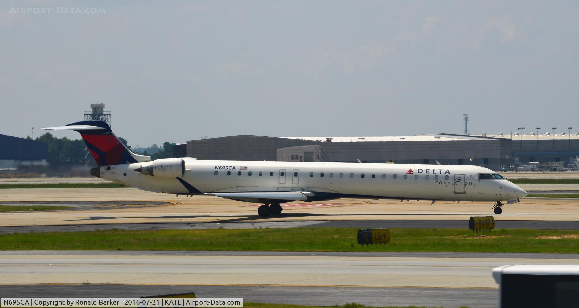 N695CA, 2006 Bombardier CRJ-900ER (CL-600-2D24) C/N 15097, Taxi to takeoff Atlanta