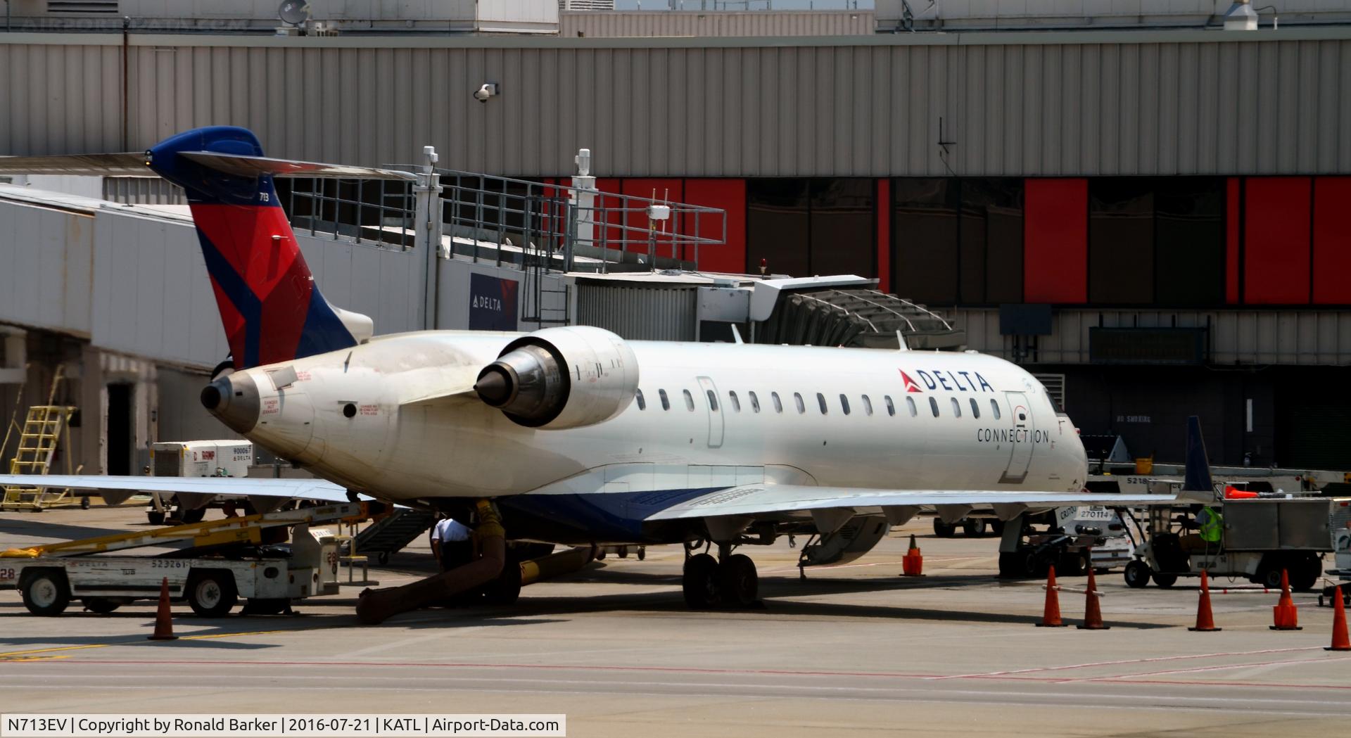 N713EV, 2003 Bombardier CRJ-701 (CL-600-2C10) Regional Jet C/N 10081, At the gate Atlanta