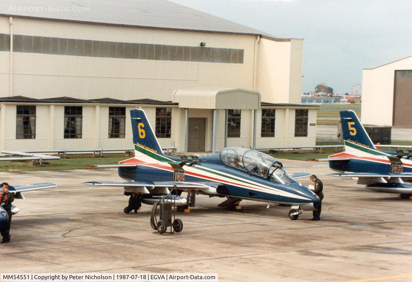 MM54551, Aermacchi MB-339PAN C/N 6772/167/AD018, MB-339A number 6 of the Frecce Tricolori display team on the flight-line at the 1987 International Air Tattoo at RAF Fairford, Gloucestershire.