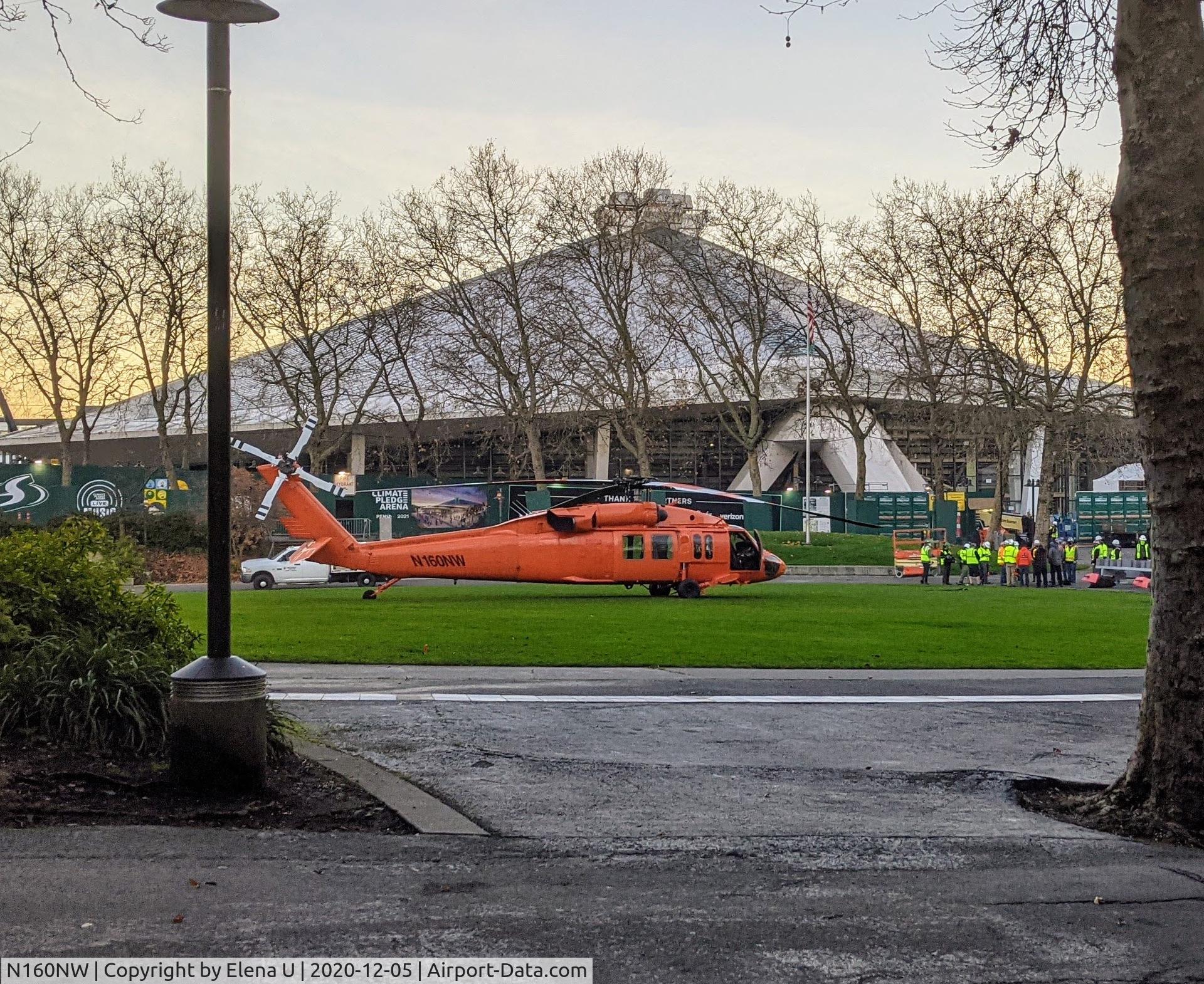 N160NW, 1979 Sikorsky UH-60A Black Hawk C/N 70-155, Helicopter preparing to put a new sign on arena