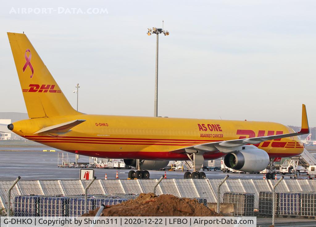G-DHKO, 2002 Boeing 757-223F C/N 32397, Parked at the Cargo apron... Special Red Ribbon logo, title against Cancer