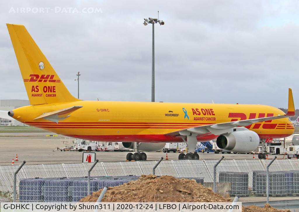 G-DHKC, 2000 Boeing 757-256/PCF C/N 29312, Parked at the Cargo apron with special 'As One against Cancer / Movember' titles with blue ribbon
