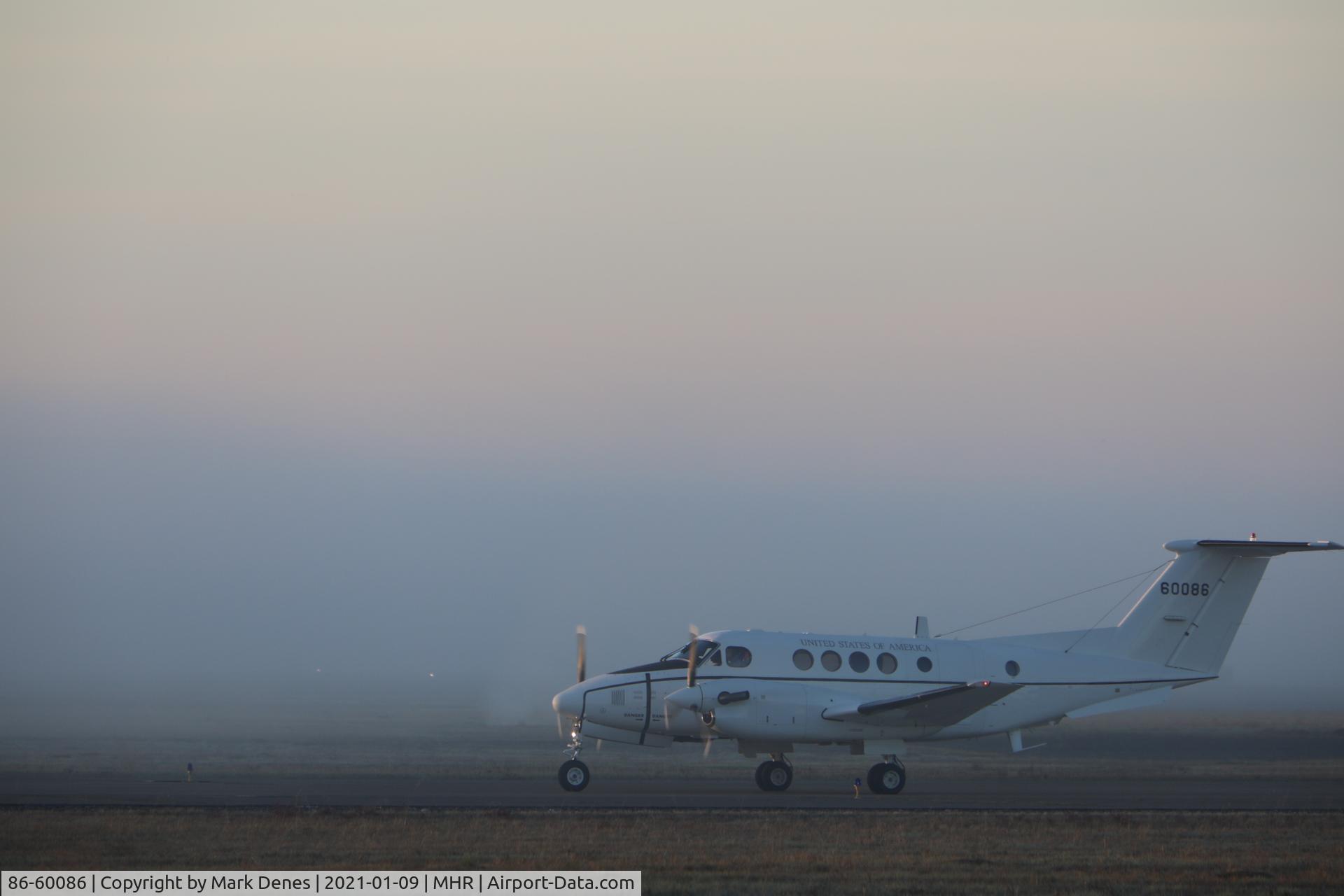 86-60086, 1986 Beech C-12T-2 Huron C/N BP-66, Photographed on Jan 9, 2021 early morning. It took off in heavy fog.
