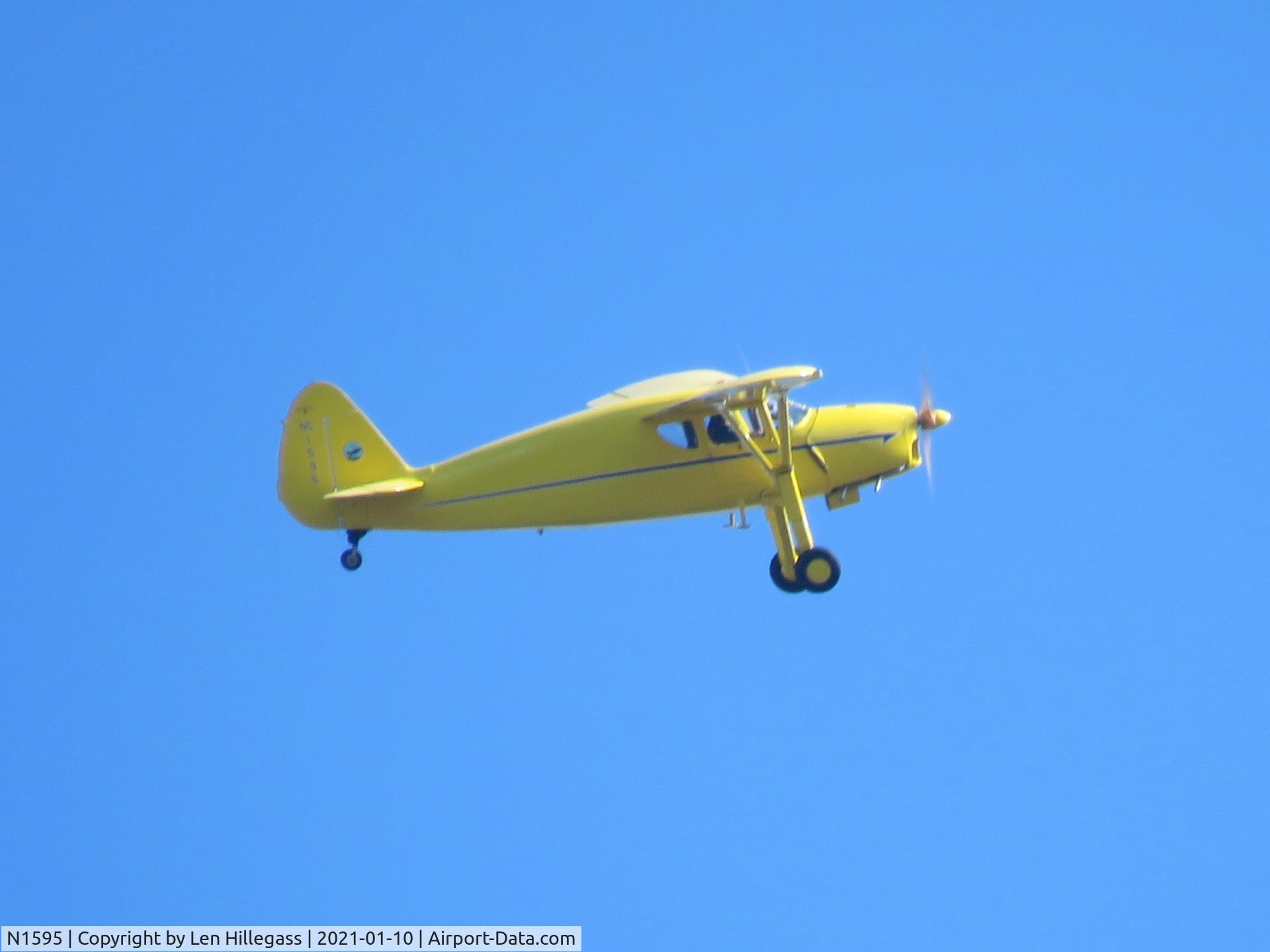 N1595, 1939 Fairchild 24R-9 C/N R9-427, Seen while it was flying over the Green Lane Reservoir at Pennsburg, PA.
Registration was seen under wing & vertically on tail.
The photo has been cropped.