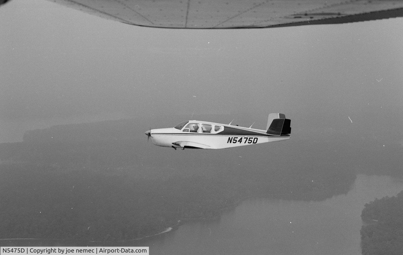 N5475D, 1957 Beech H35 Bonanza C/N D-4994, over lake houston