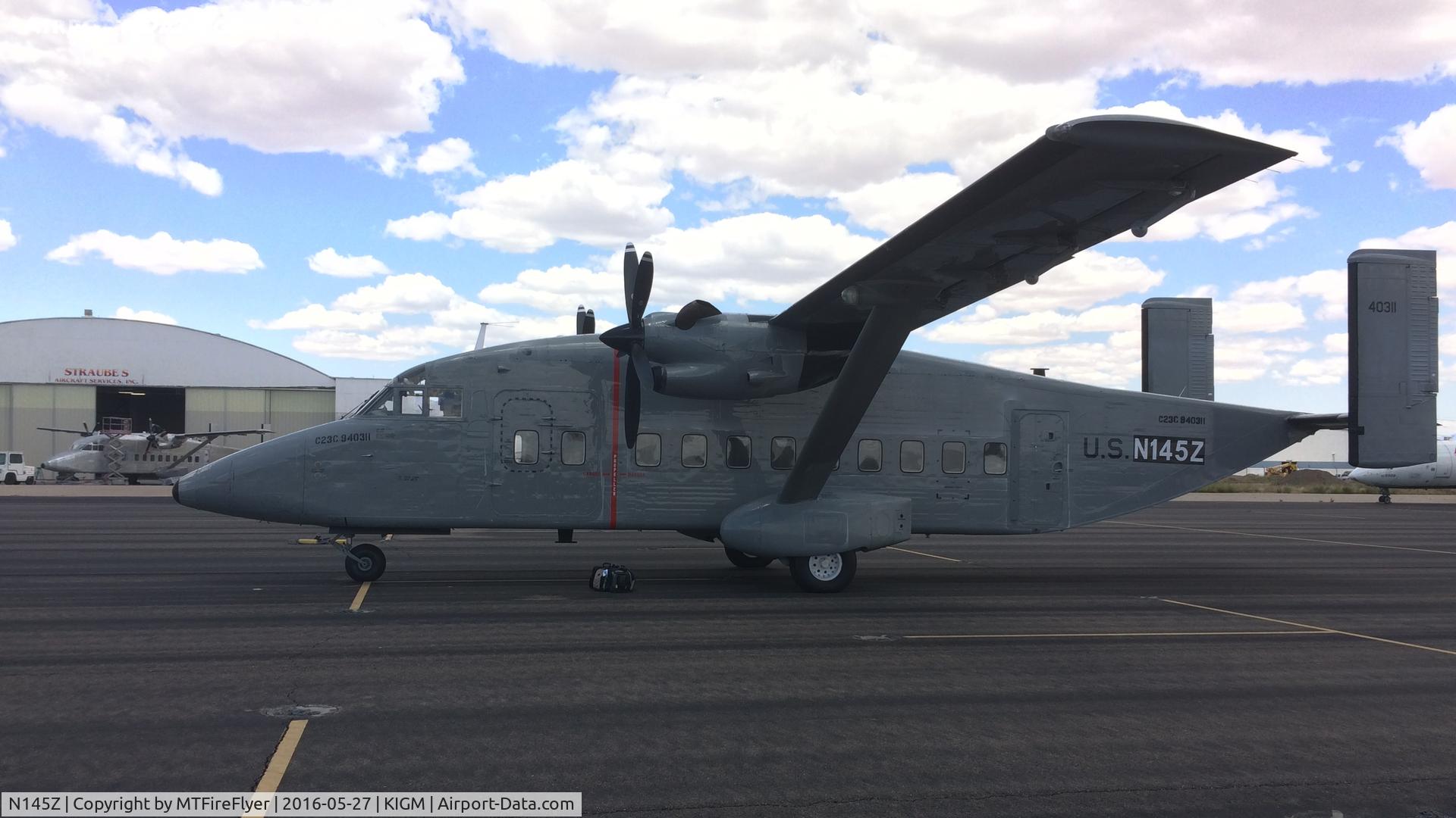N145Z, 1998 Short SD3-60 (C-23C) C/N SH3425, C-23C N145Z (94-0311) on Straube's ramp in Kingman, AZ (KIGM/IGM) to be fitted with new US Forest Service uniform.
