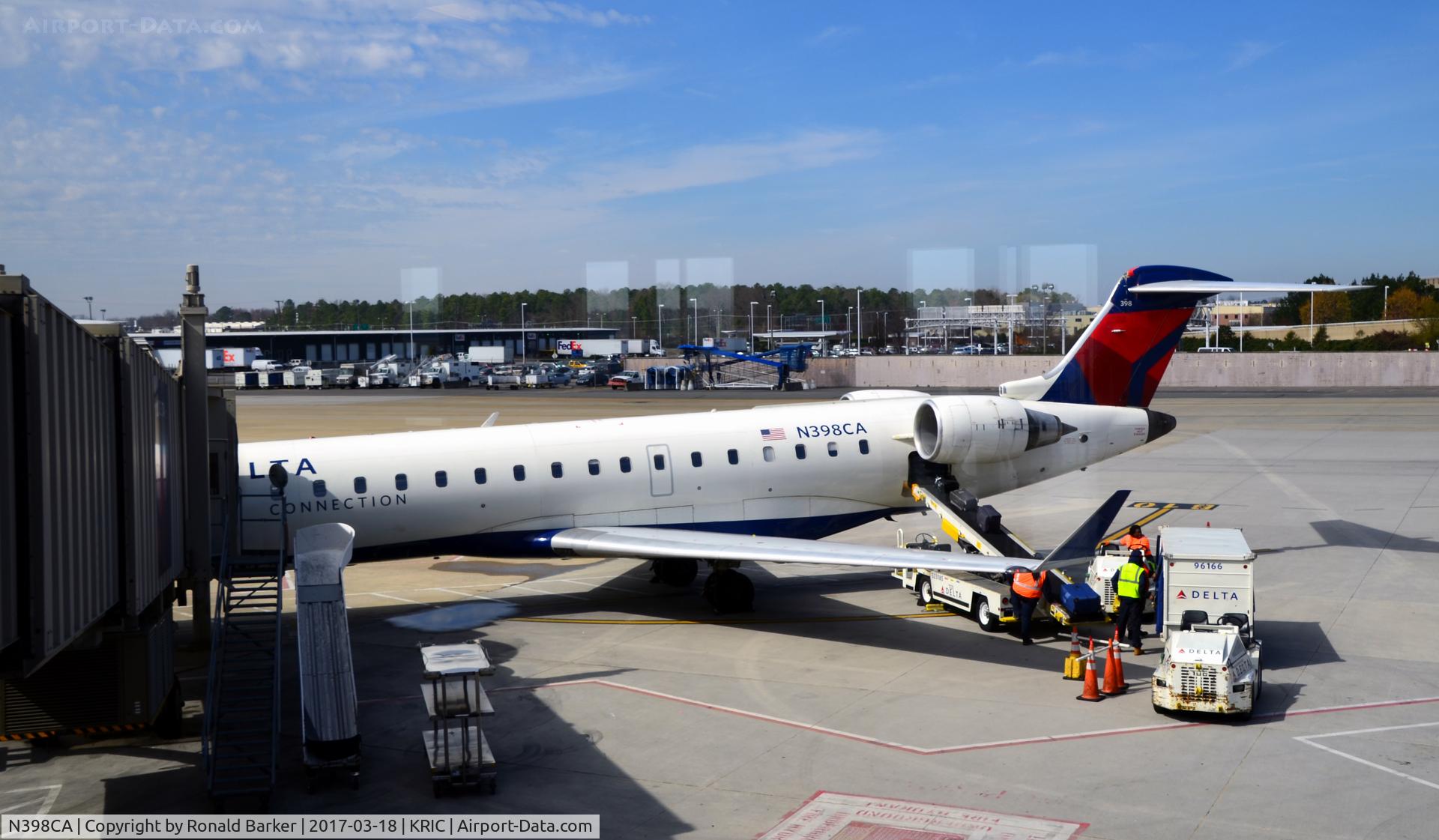 N398CA, 2003 Bombardier CRJ-700 (CL-600-2C10) Regional Jet C/N 10112, At the gate Richmond