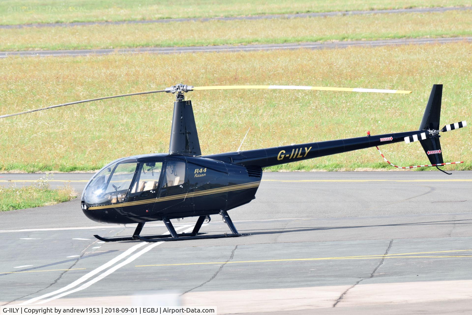 G-IILY, 2000 Robinson R44 Raven C/N 0960, G-IILY at Gloucestershire Airport.