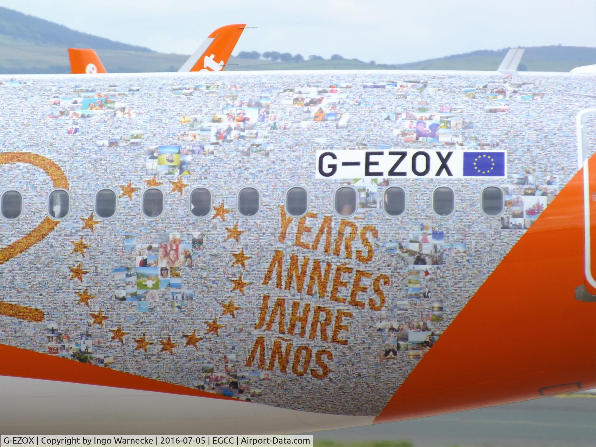 G-EZOX, 2015 Airbus A320-214 C/N 6837, Airbus A320-214 of easyJet in special '20 years jubilee' colours at Manchester airport. The background seems to be composed of thousands of holiday fotos.