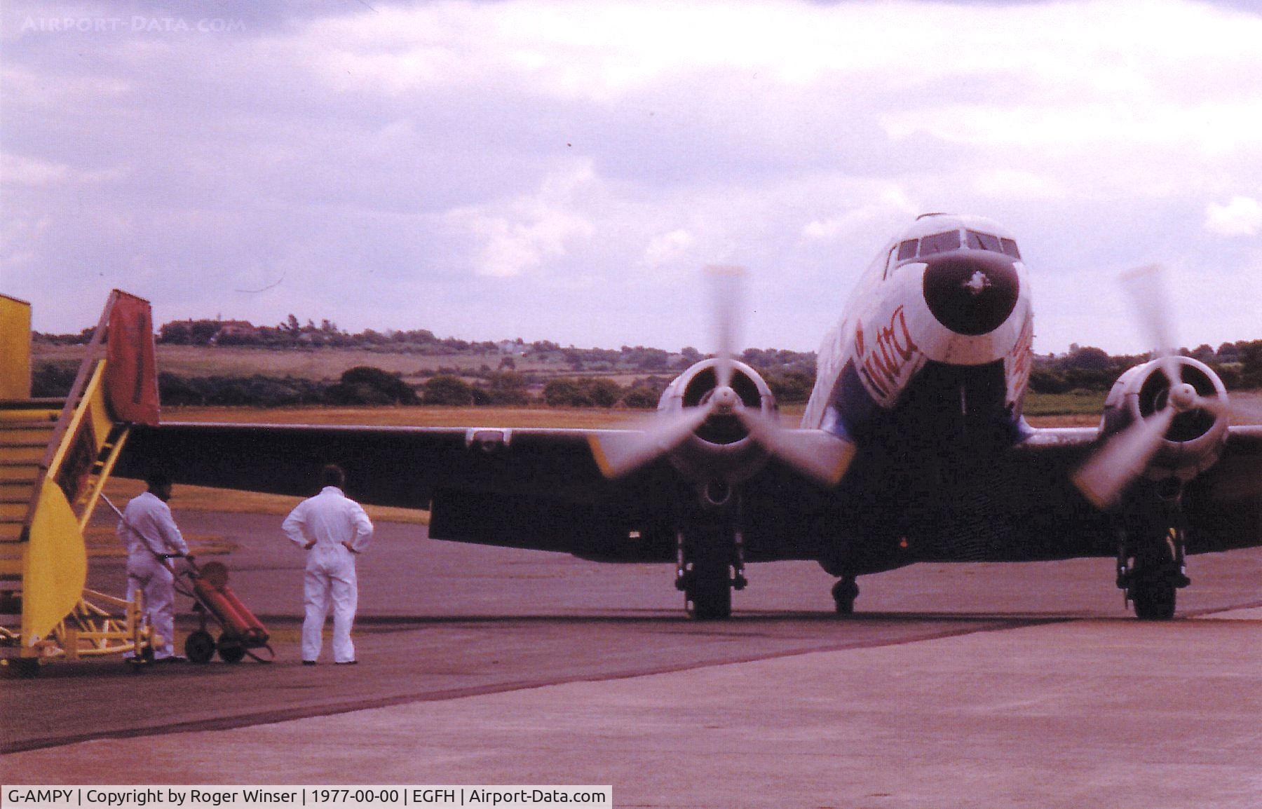 G-AMPY, 1944 Douglas C-47B-15-DK Dakota 4 C/N 26569, Dakota 4 of Intra Airways at Swansea Airport circa 1977.