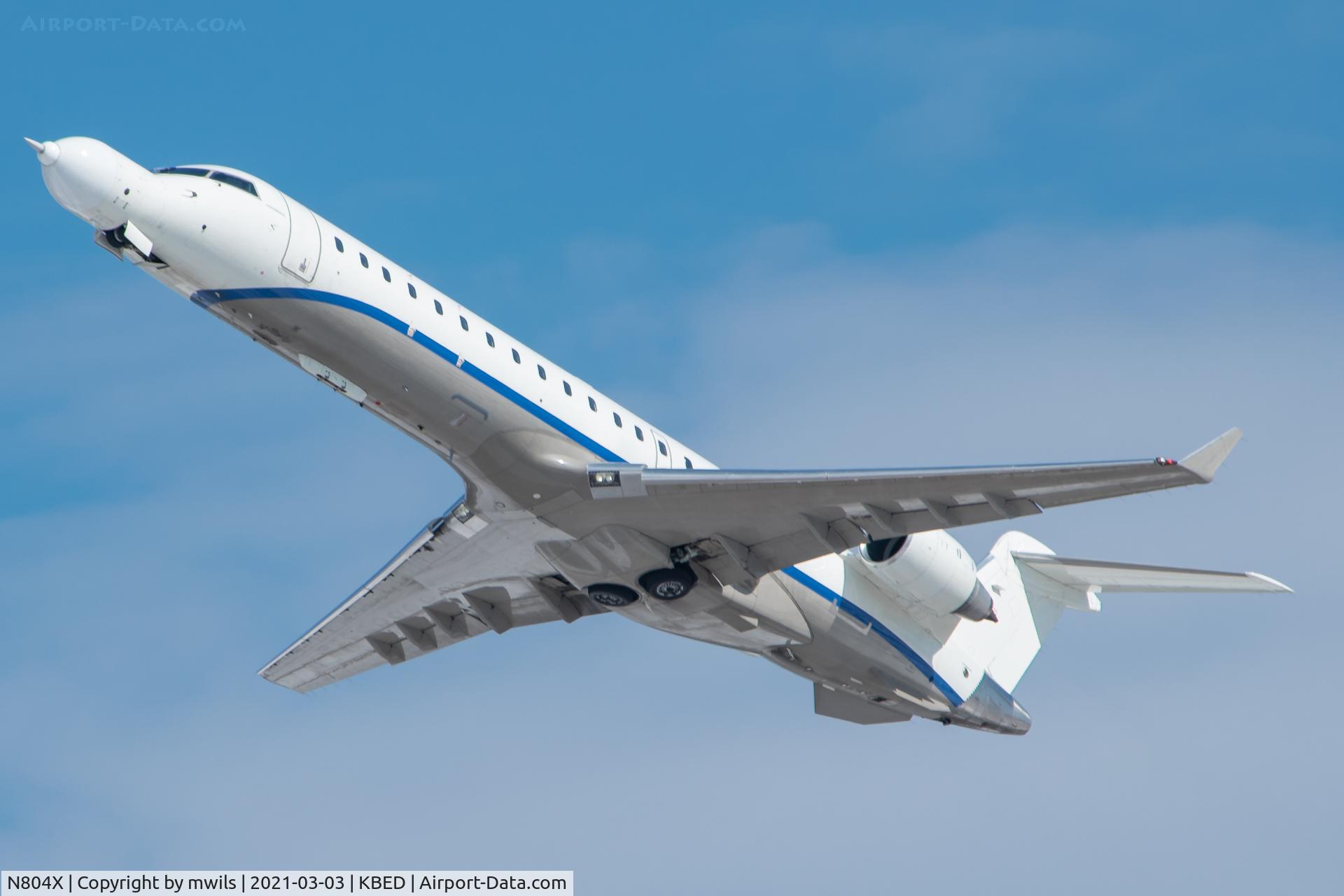 N804X, 1999 Canadair CRJ-700 (CL-600-2C10) Regional Jet C/N 10002, SCAN04 arriving into KBED with Research 8TB in tow.