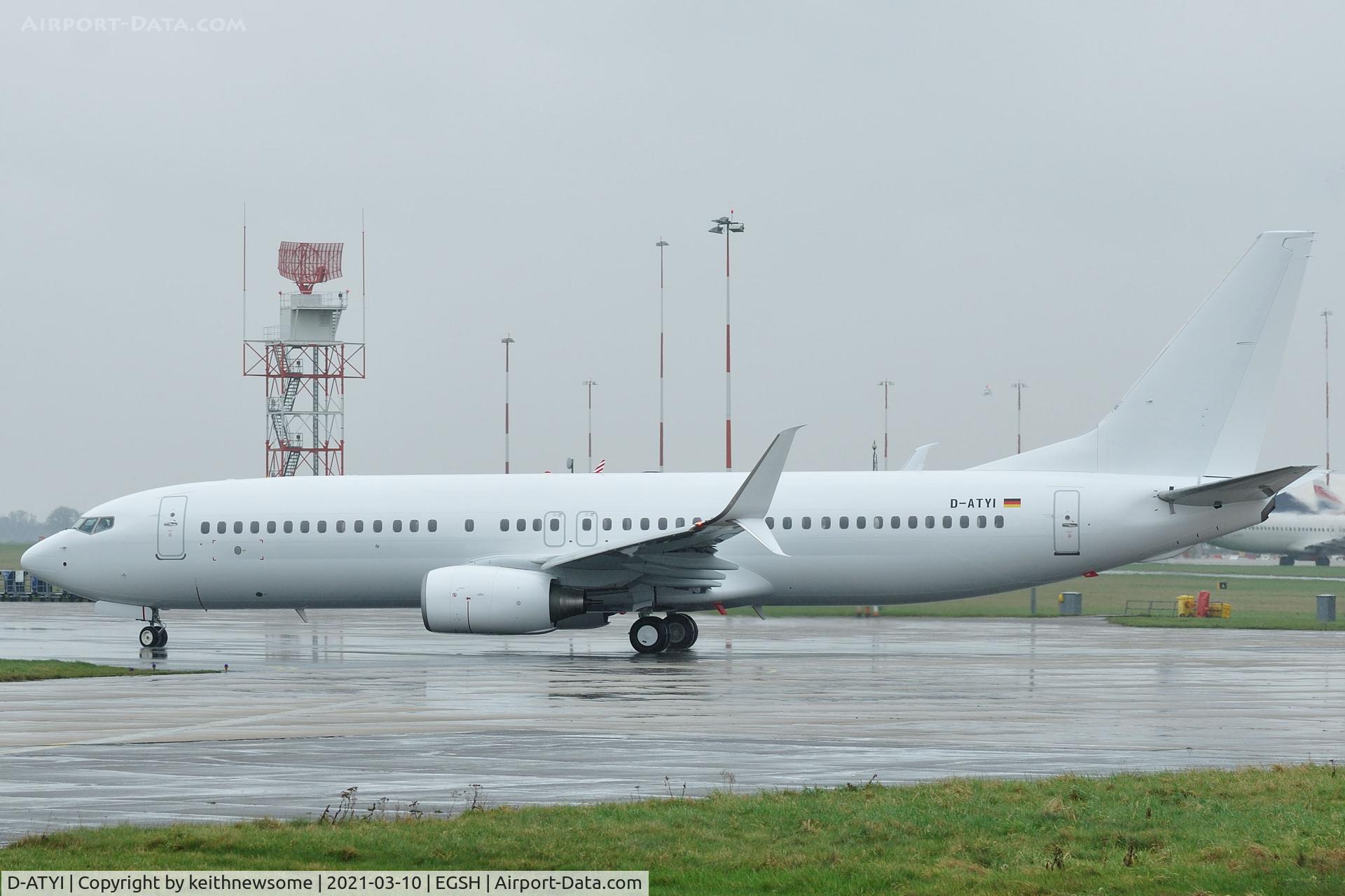 D-ATYI, 2011 Boeing 737-8K5 C/N 37254, Leaving Norwich for Brussels with all over white colour scheme.