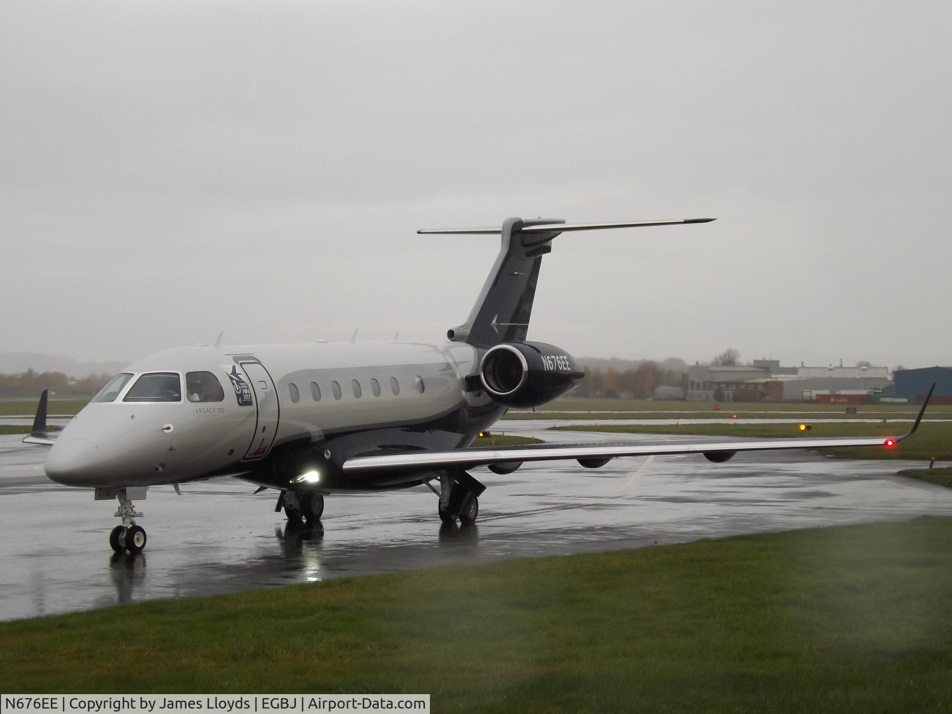 N676EE, 2018 Embraer EMB-550 Legacy 500 C/N 55000076, Taxing in at a wet Gloucestershire Airport.