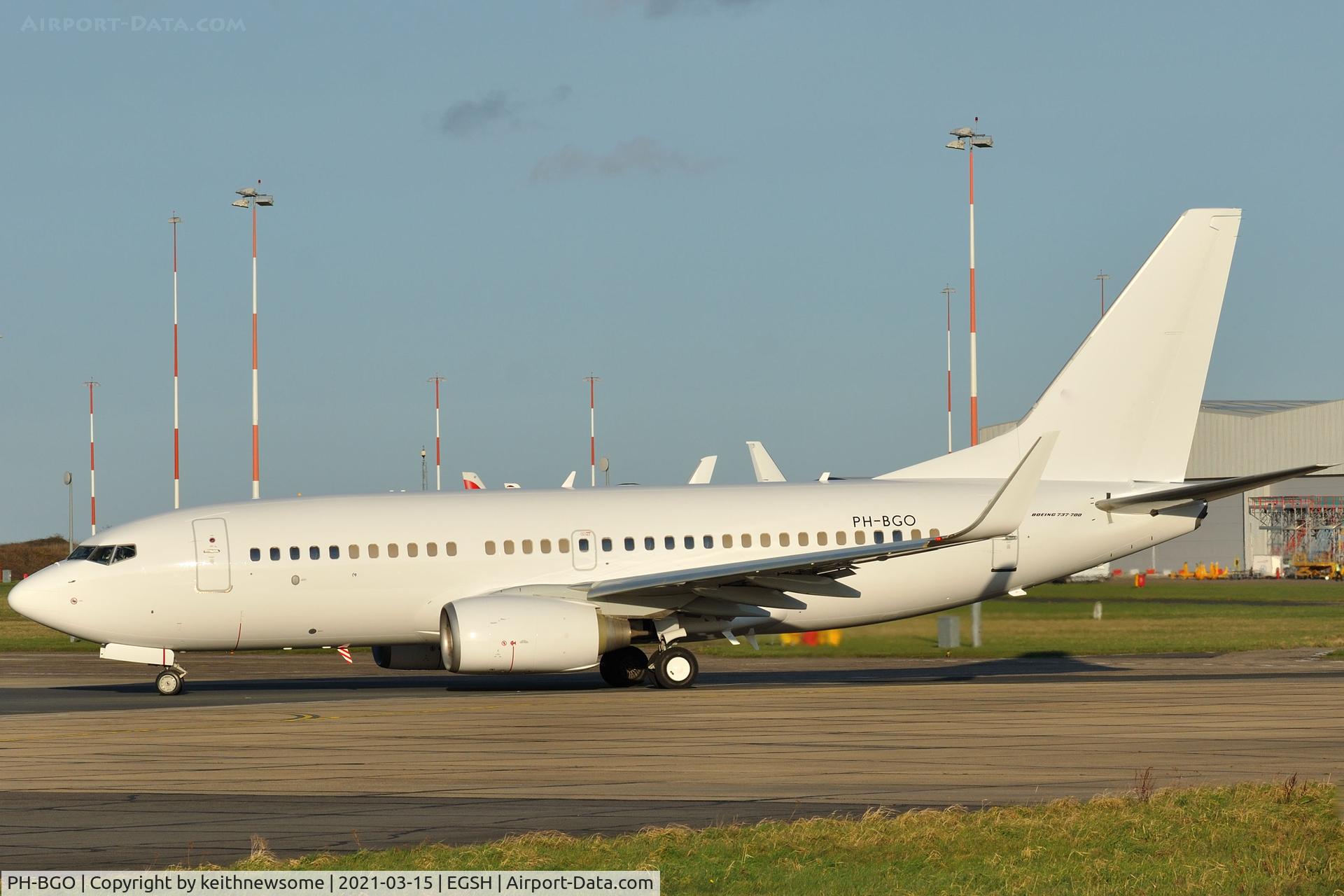 PH-BGO, 2011 Boeing 737-7K2 C/N 38126, Leaving Norwich with all over white colour scheme.