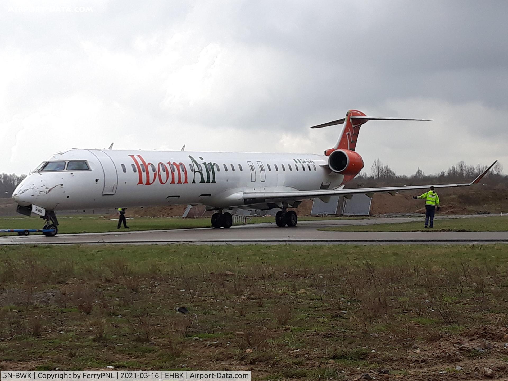 5N-BWK, 2011 Bombardier CRJ-900LR (CL-600-2D24) C/N 15271, Ibom Air CL900 pushed into its storage location