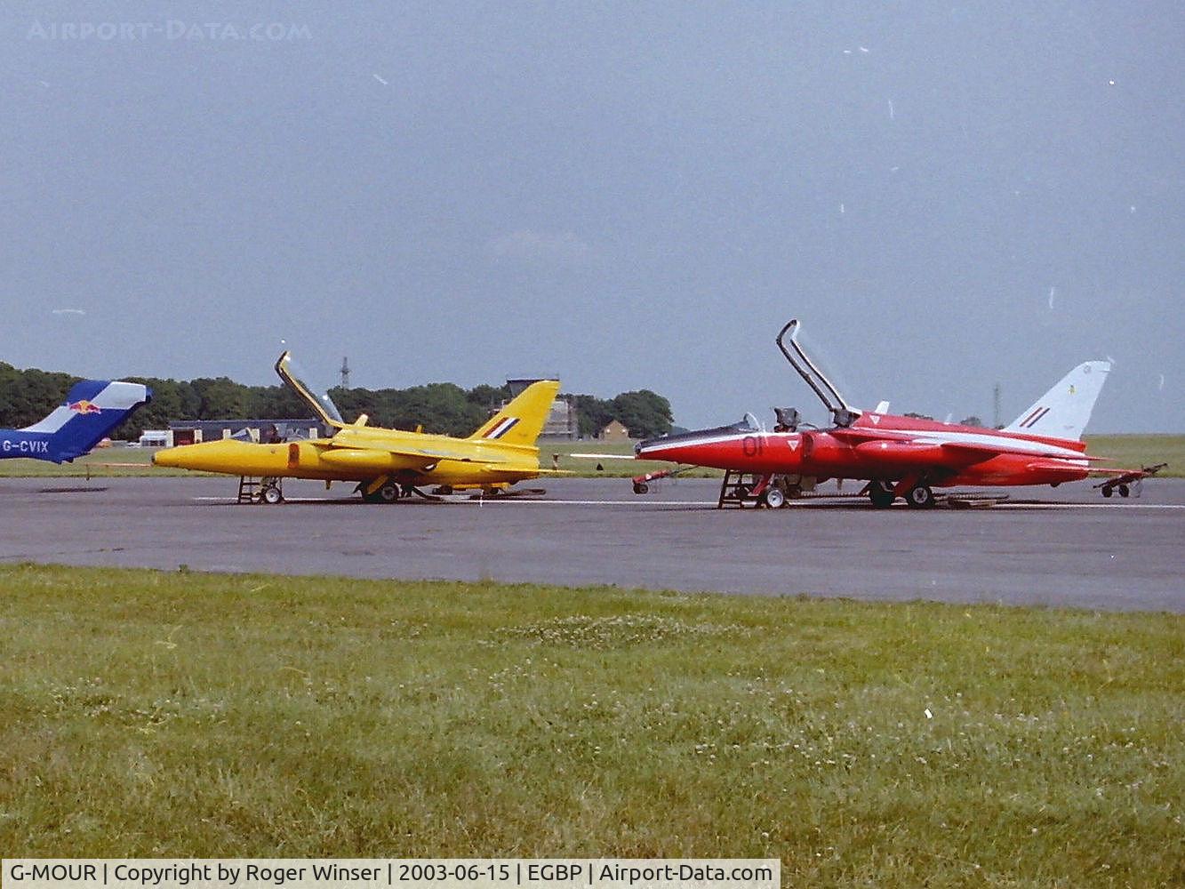 G-MOUR, 1964 Hawker Siddeley Gnat T.1 C/N FL596, Ex-XS102. In RAF Yellowjacks colour scheme carrying s/n XR991 with G-RORI (ex-XR538 coded 01) on display at Kemble Airfield.