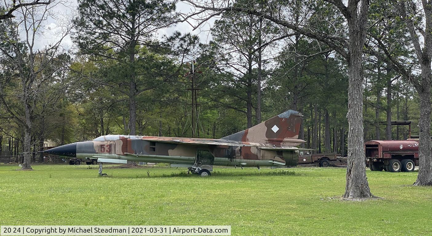 20 24, Mikoyan-Gurevich MiG-23 C/N Not found 20 24, MiG-23 in field just north of Holt, FL.