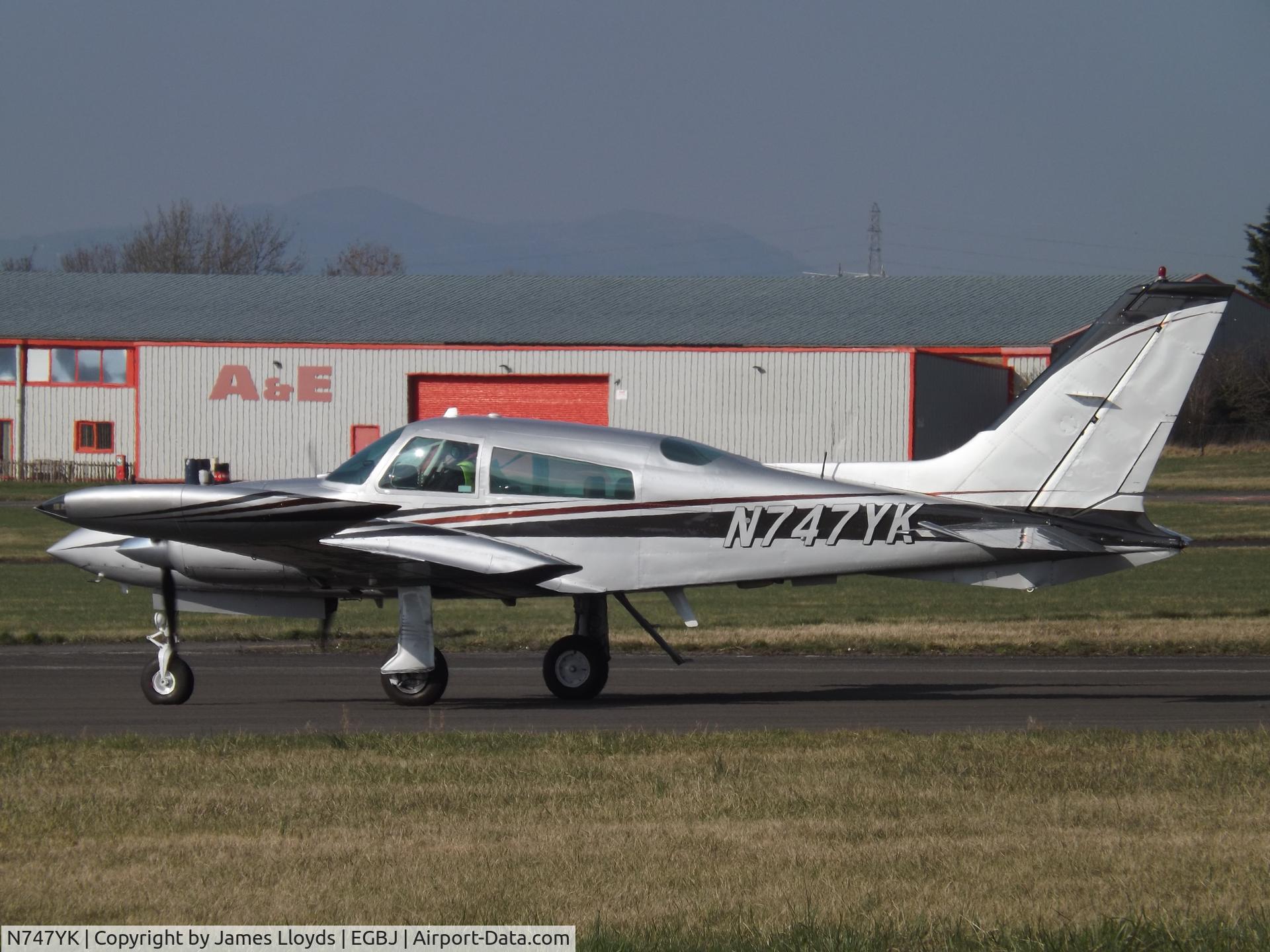 N747YK, 1975 Cessna 310R C/N 310R0138, About to dep Runway 27 at Gloucestershire Airport.