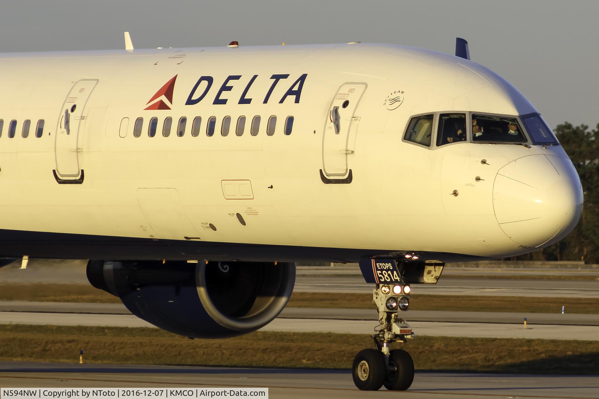 N594NW, 2003 Boeing 757-351 C/N 32994, Taxiing in golden hour in Orlando.