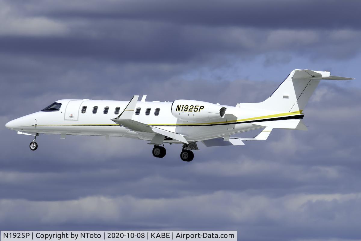 N1925P, 2002 Learjet 45 C/N 199, Arriving on a cloudy day with a peak of sun for contrast.
