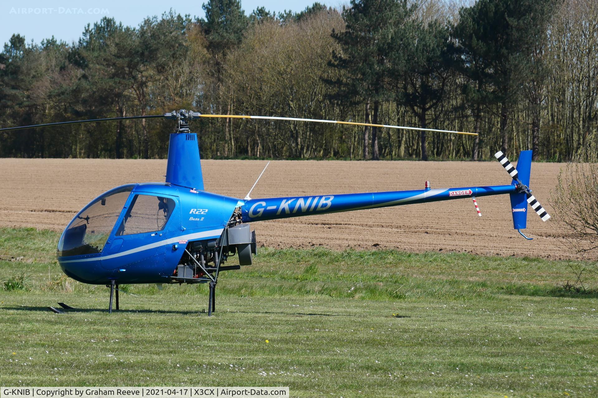 G-KNIB, 2000 Robinson R22 Beta C/N 3145, Parked at Northrepps.