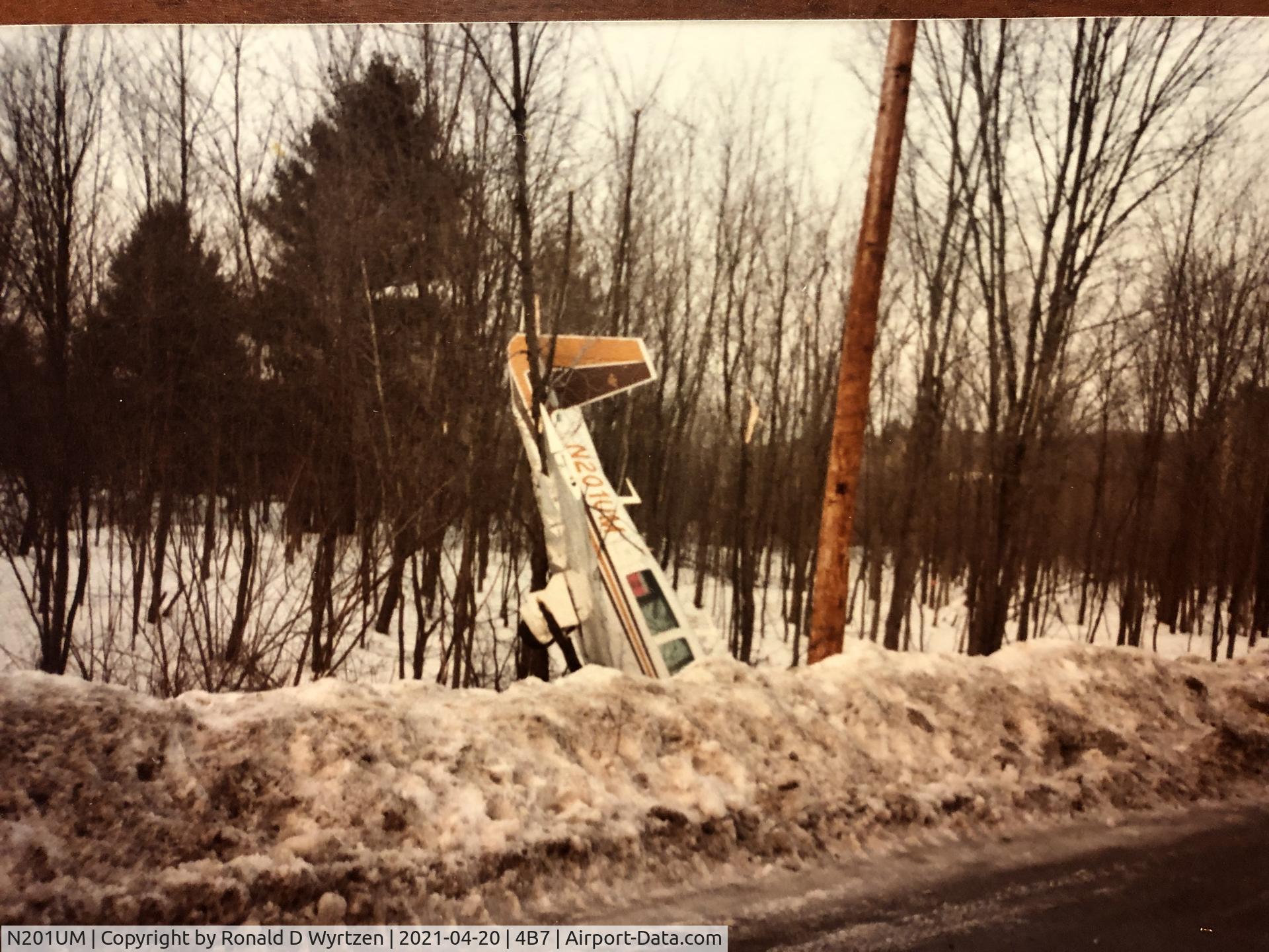 N201UM, 1977 Mooney M20J 201 C/N 24-0374, Nosed into a snowbank at Schroon Lake NY after an aborted landing at Schroon Lake, NY.  Stalled and nosed into snowbank. I don't believe the pilot was hurt.  This was in the early 80's