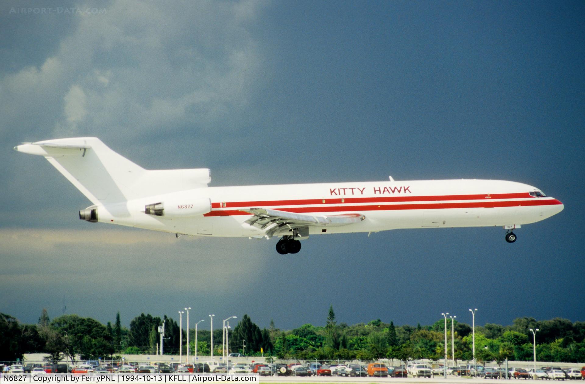 N6827, 1969 Boeing 727-223 C/N 20180, Kitty Hawk B727 freighter landing with thunderstorm looming behind.