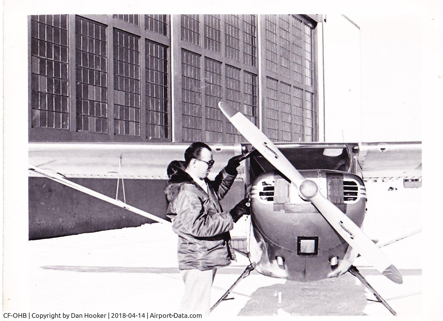 CF-OHB, 1946 Cessna 140X C/N 11571X, Photo taken in front of Canadian Airforce hanger at Goose Bay Air base with USAF intercept service in 1964.  I was preflighting for local flight.