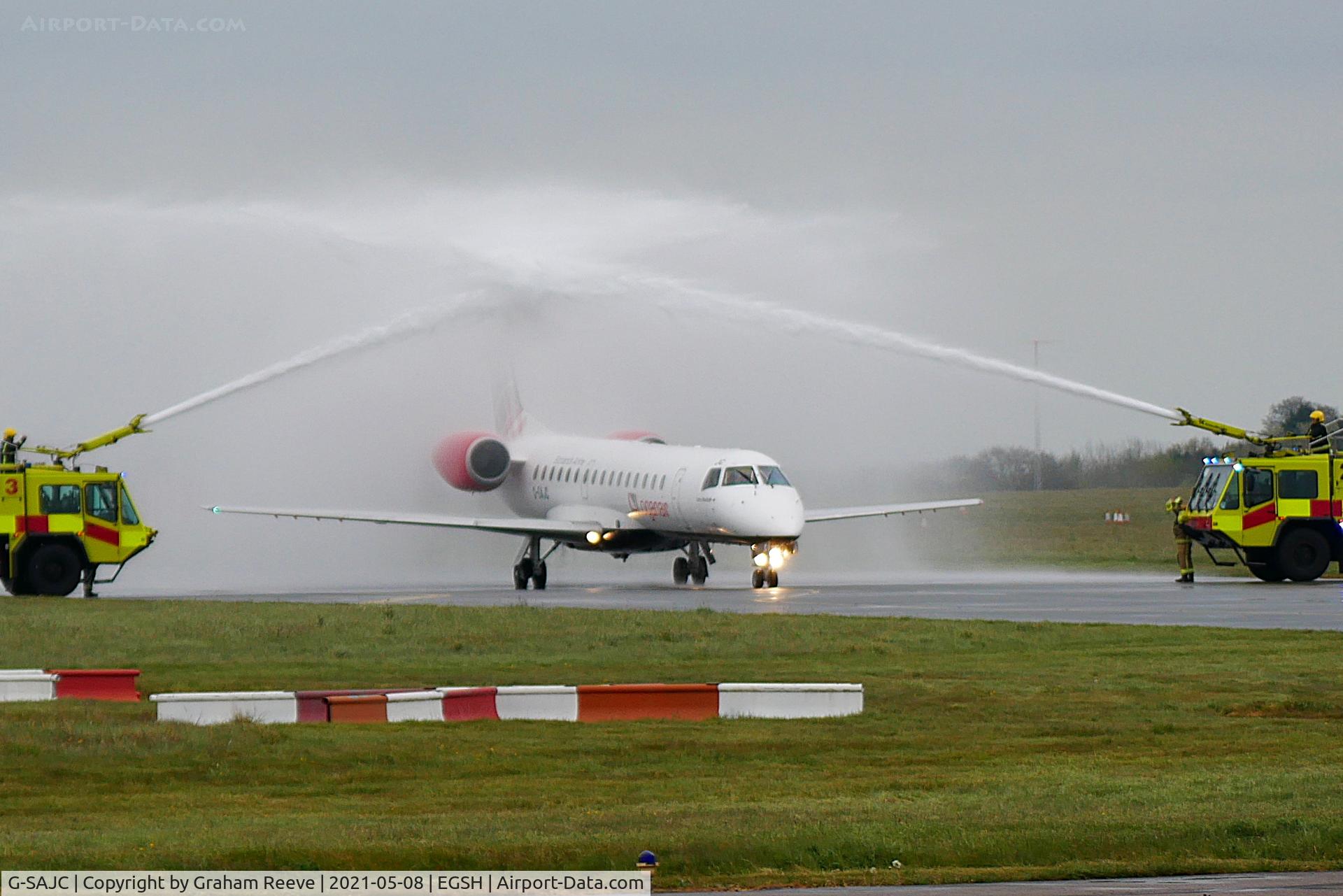 G-SAJC, 2000 Embraer EMB-145EP (ERJ-145EP) C/N 145280, Norwich City Football Club, receives a salute from the Airport.