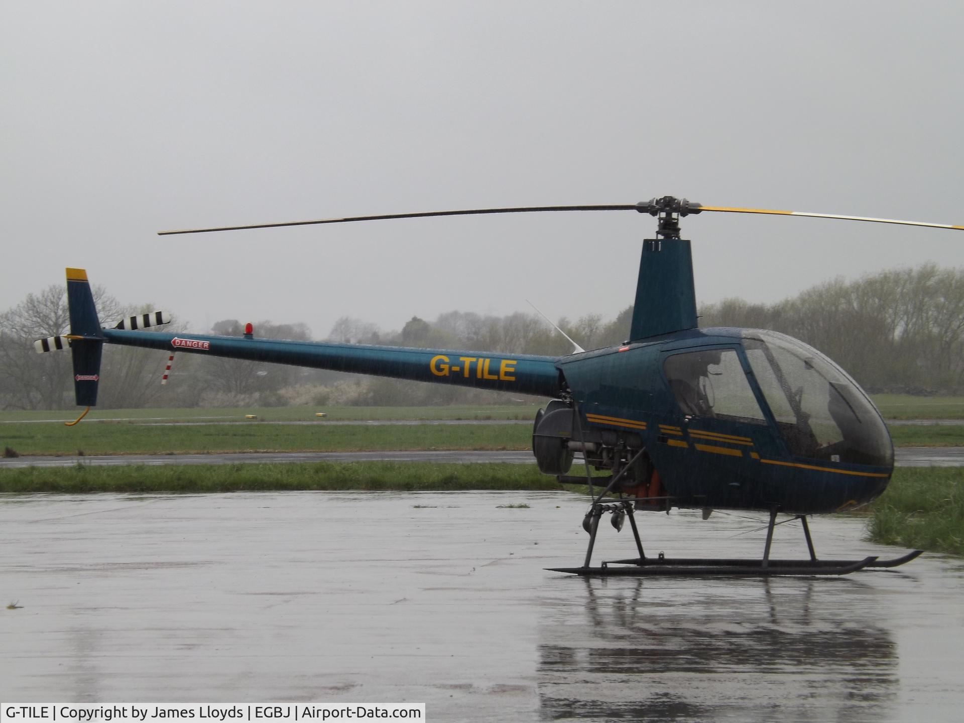 G-TILE, 1989 Robinson R22 Beta C/N 1100, Parked at Gloucestershire Airport.