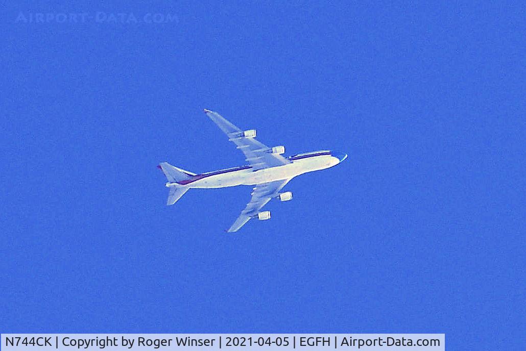 N744CK, 1993 Boeing 747-446 C/N 26353, B744 aircraft operated by Kalita Air in Face Mask Livery westbound at 30000 feet over Swansea Airport.