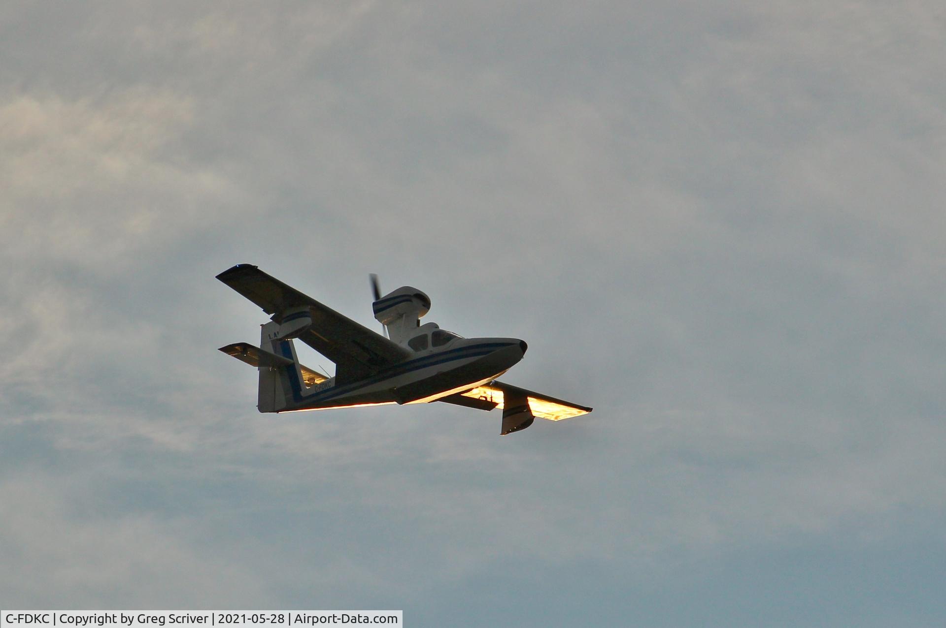 C-FDKC, 1964 Lake LA-4-180 Amphibian C/N 281, Flying over the Ottawa River during a golden sunset