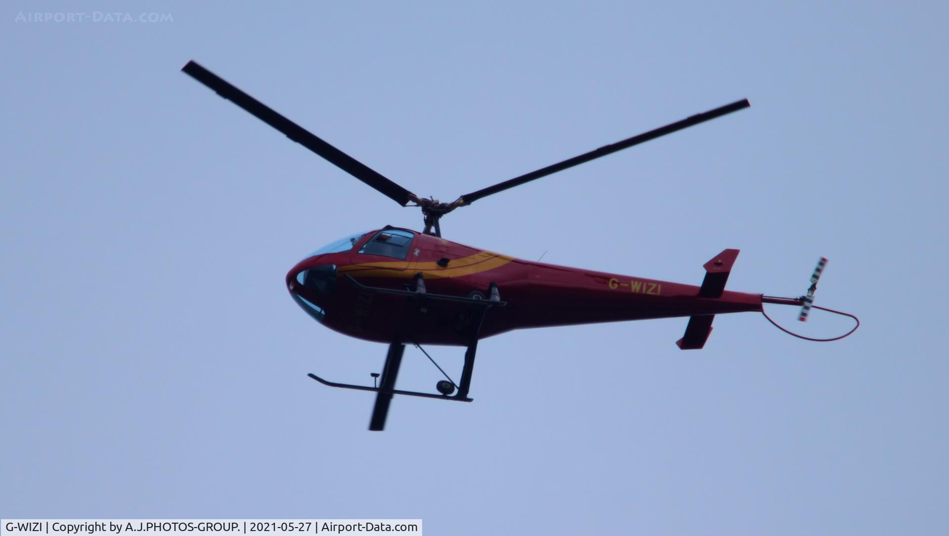 G-WIZI, 1989 Enstrom 280FX Shark C/N 2040, just passing my window at home heading for barton
