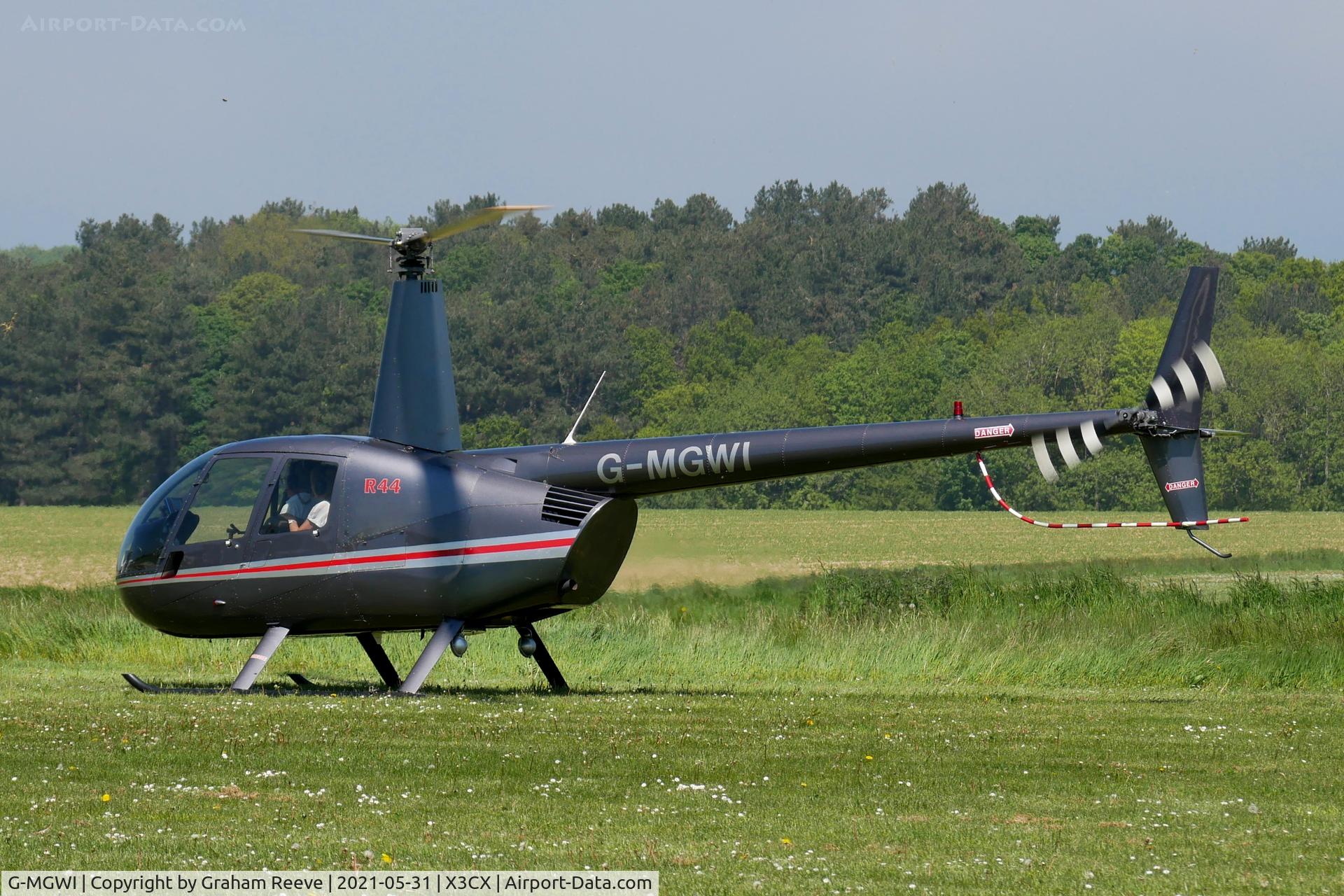 G-MGWI, 2000 Robinson R44 Astro C/N 0663, Just landed at Northrepps.