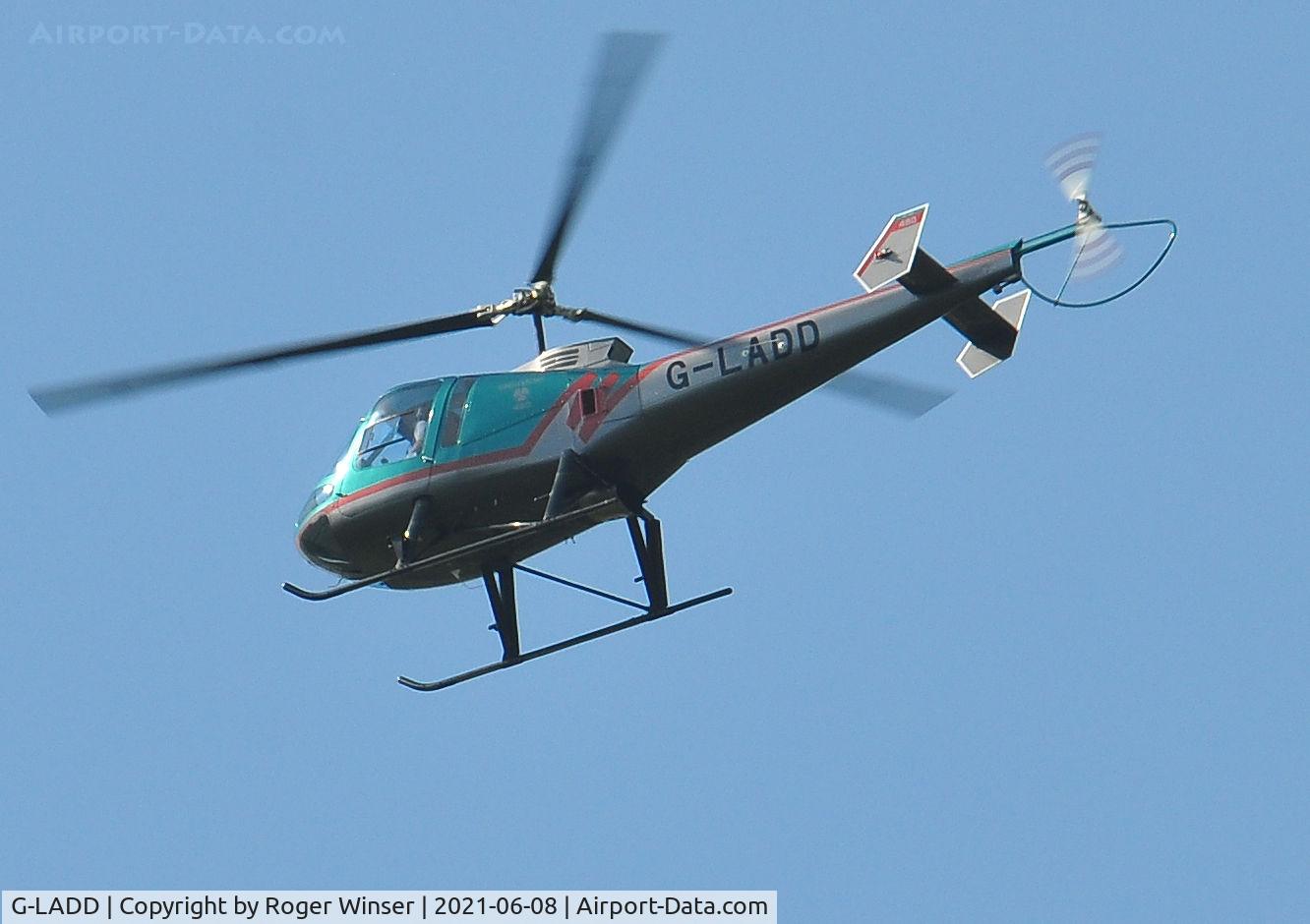 G-LADD, 1999 Enstrom 480 C/N 5037, Off airport. Seen flying over Swansea, Wales, UK returning to base.