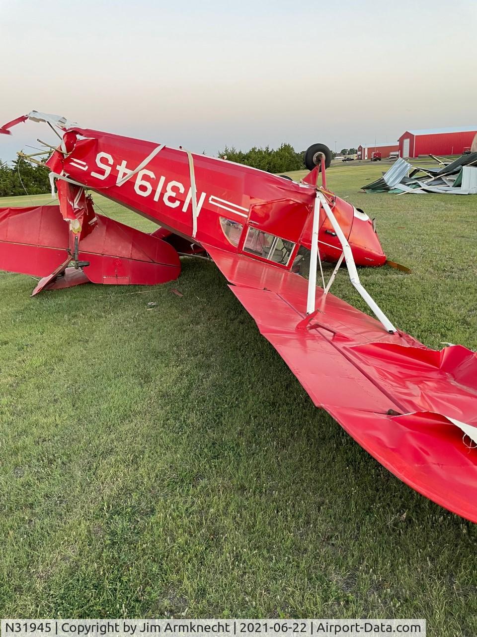 N31945, 1941 Aeronca 65-LB C/N L-12141, This is the result of wind damage on 6/21/21 Hoxie Kansas. See the destroyed hanger in the background.