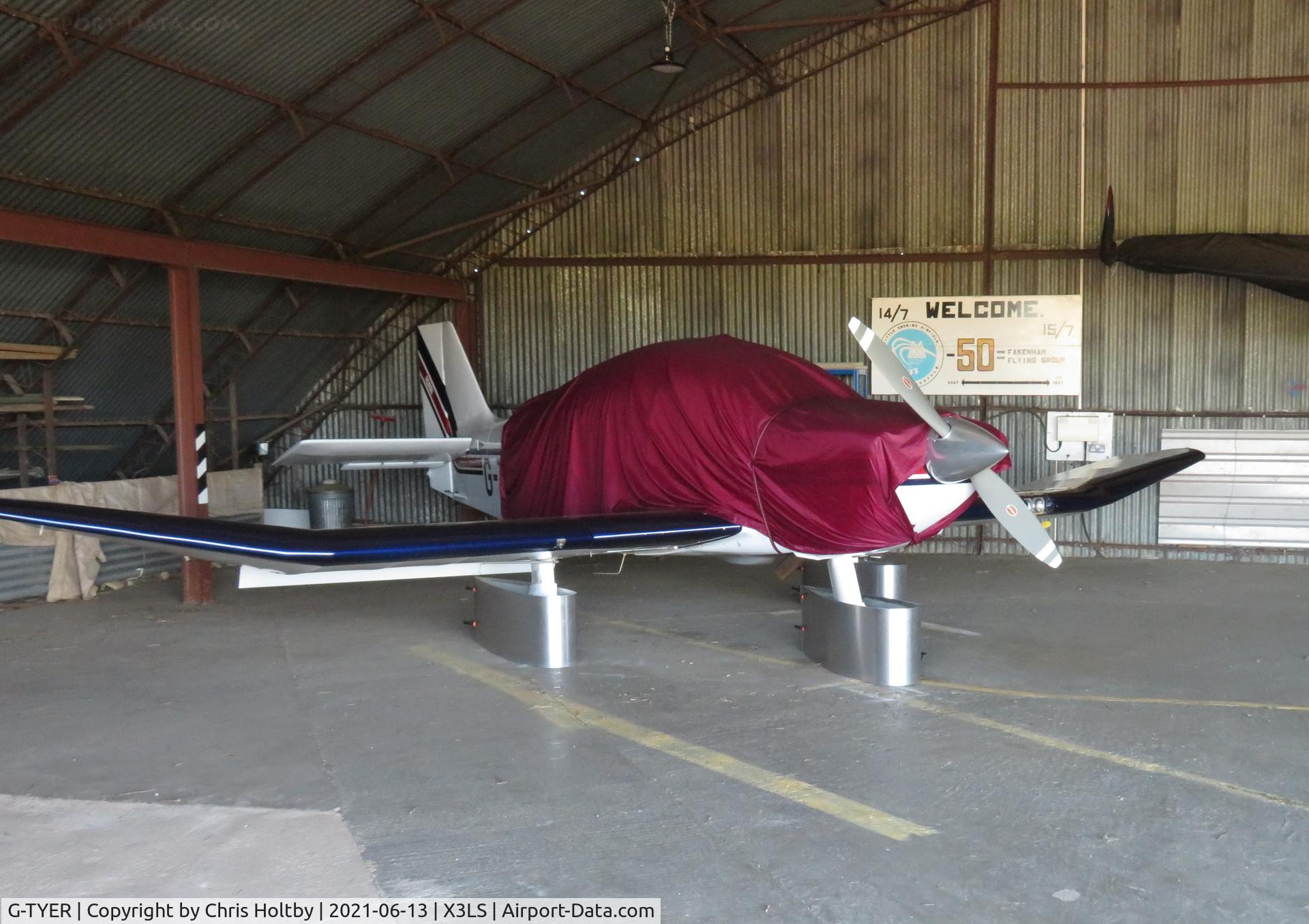 G-TYER, 2000 Robin DR-400-500 President C/N 21, Covered in the hangar at its base at Little Snoring Airfield, Norfolk. Privately owned in Fakenham, Norfolk
