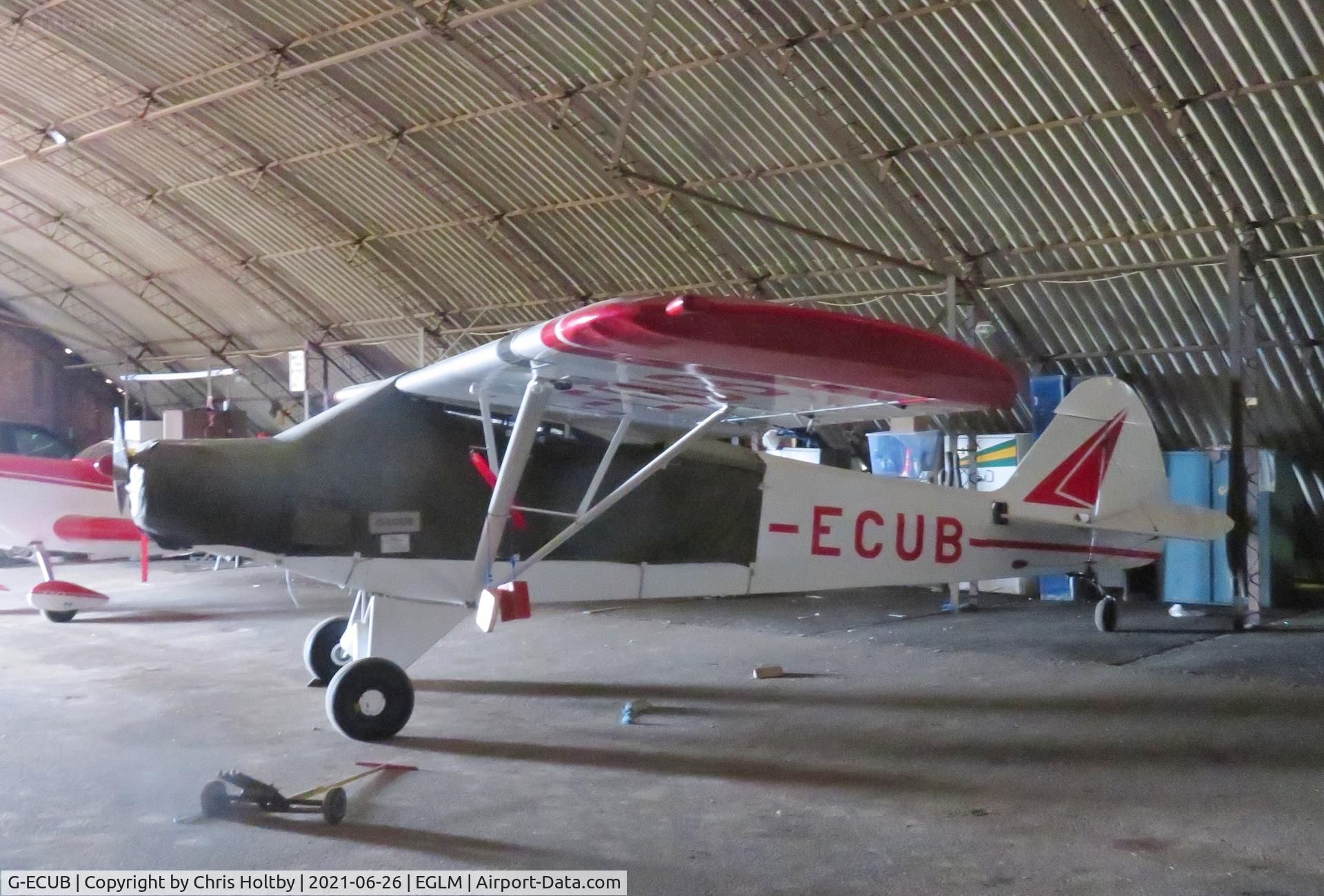 G-ECUB, 1958 Piper PA-18 Super Cub C/N 18-6279, Parked and covered in the hangar at White Waltham, Berkshire