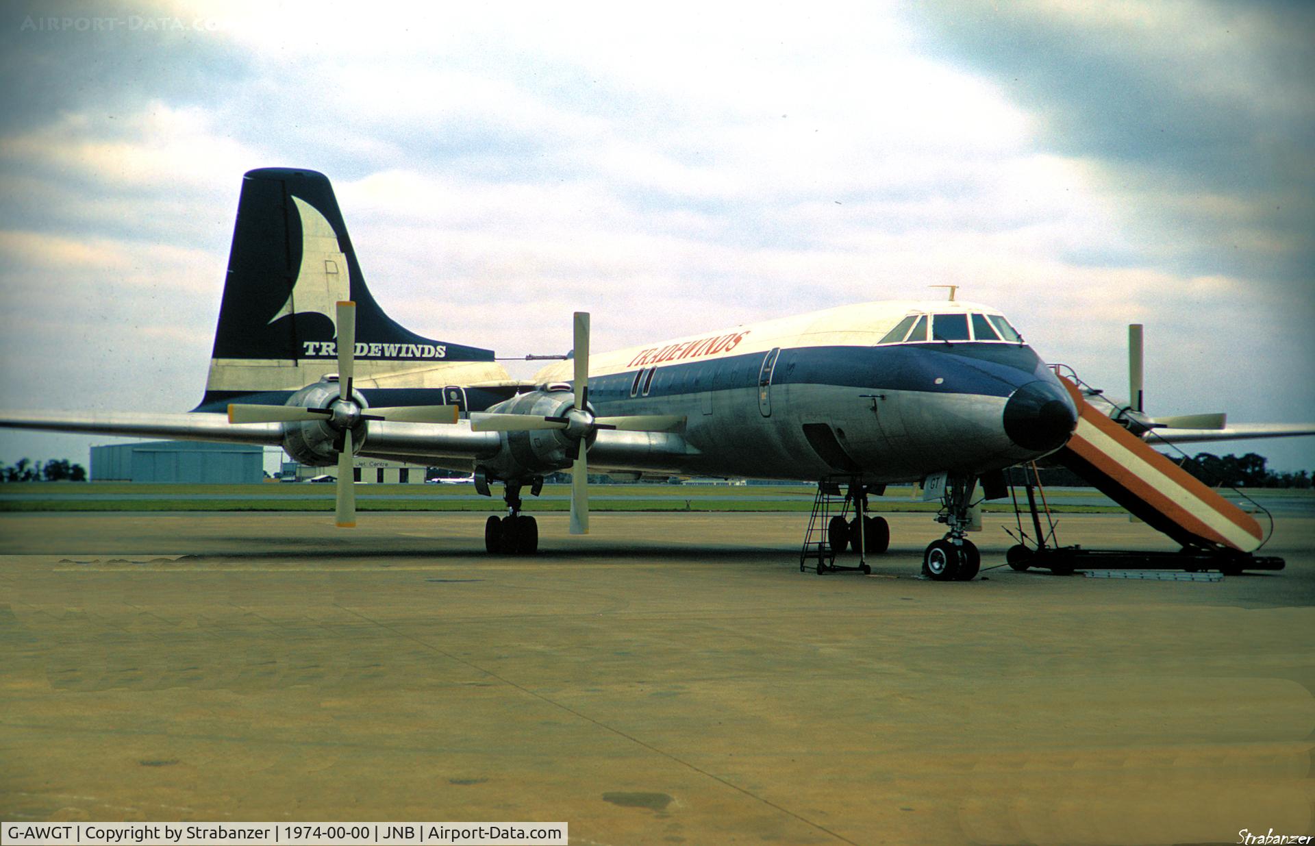 G-AWGT, 1962 Canadair CL-44D4-1 C/N 30, Scanned from an old slide.    The vignette effect comes from taking the original through a chain-link fence!
