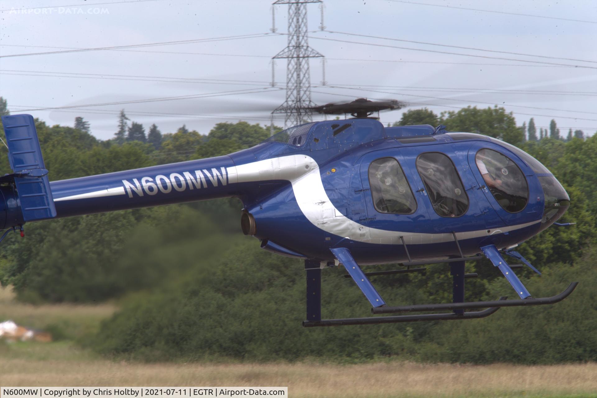 N600MW, 2001 MD Helicopters 600N C/N RN064, Lifting off at Elstree