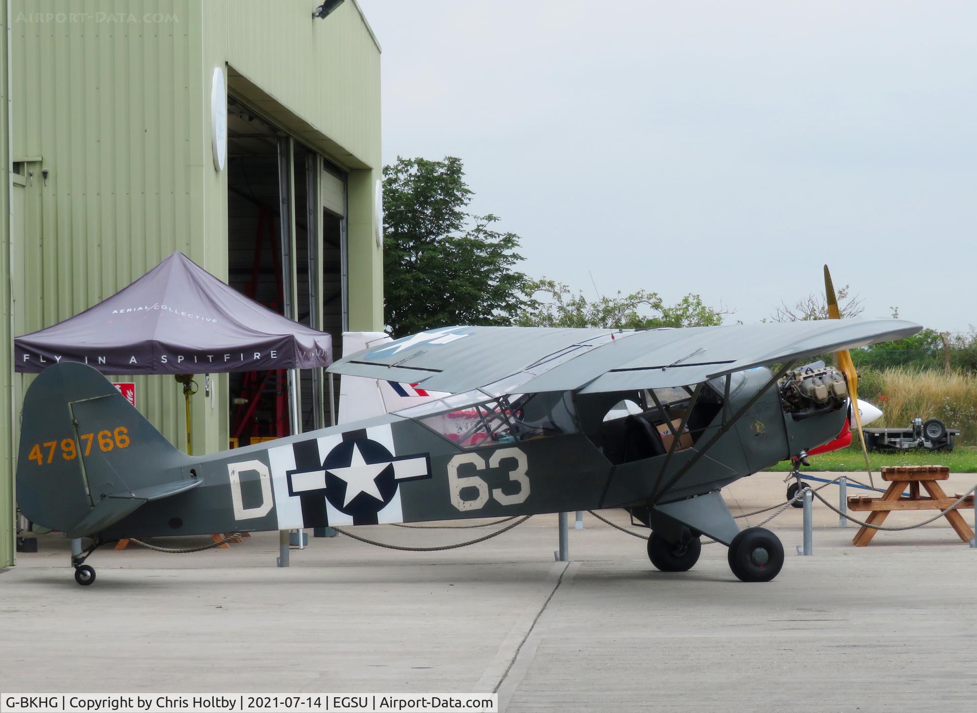 G-BKHG, 1942 Piper L-4H Grasshopper (J3C-65D) C/N 12062, 1942 Piper Grasshopper outside the restoration hangar at Duxford.