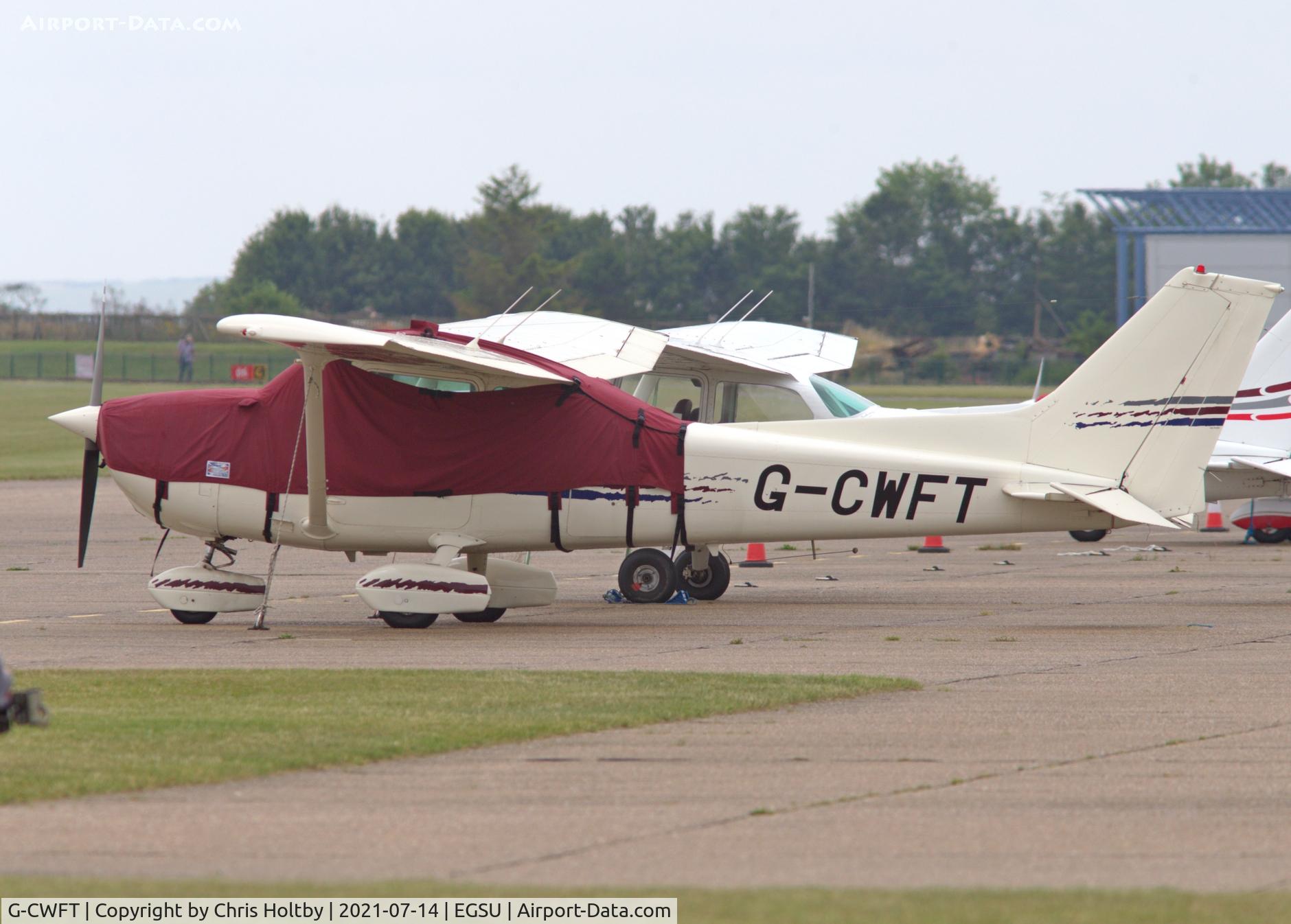G-CWFT, 1979 Cessna 172N C/N 17273576, Parked and covered at Duxford Airfield