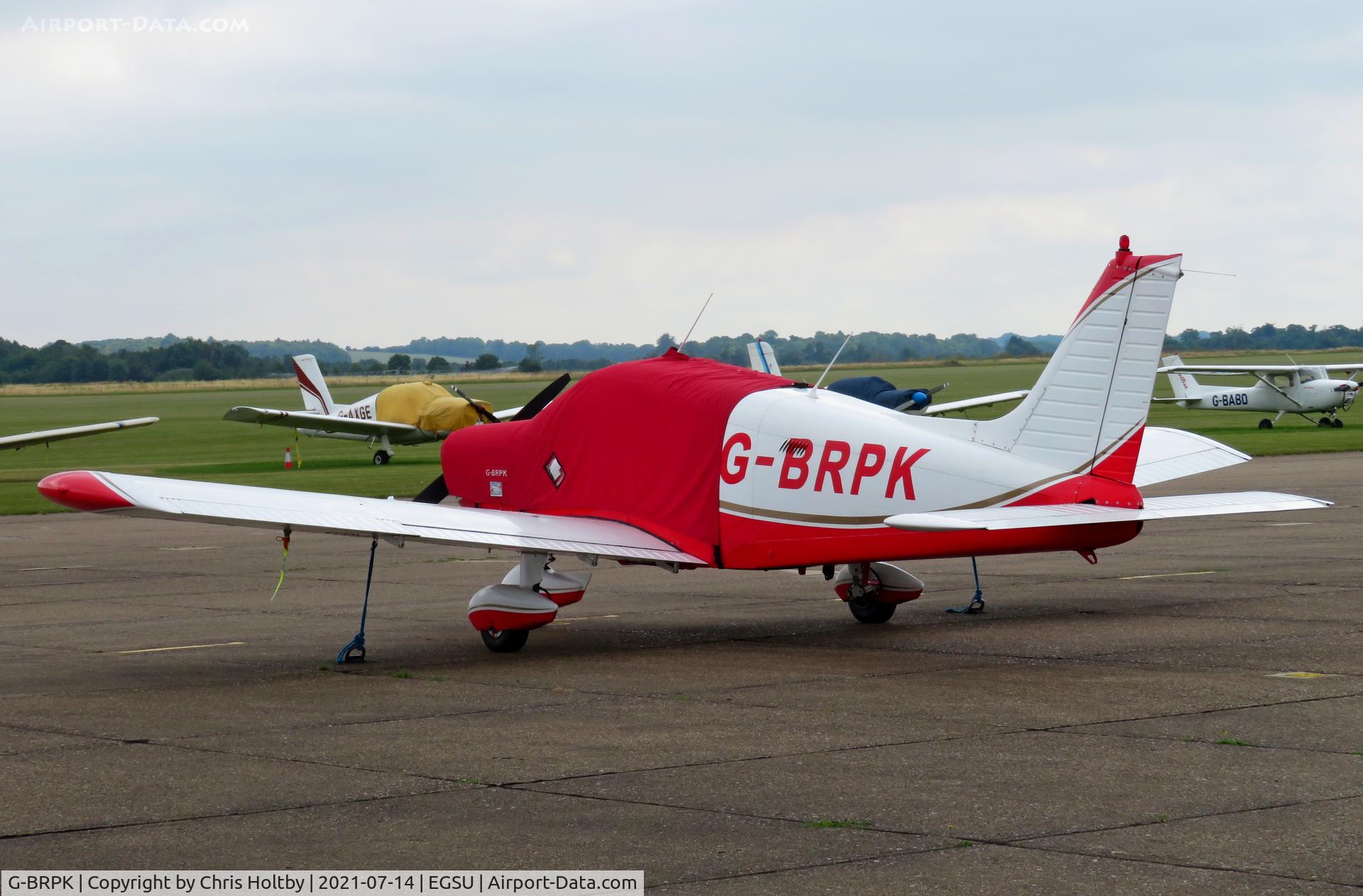 G-BRPK, 1972 Piper PA-28-140 Cherokee C/N 28-7325070, Parked and covered at Duxford Airfield Cambs.