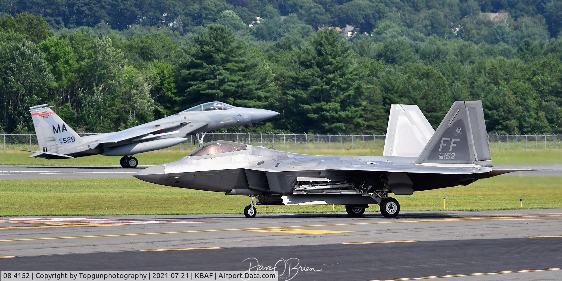 08-4152, 2009 Lockheed Martin F-22A Raptor C/N 4152, DEMON2 taxis back to the hanger while MONSTER1 touches down.