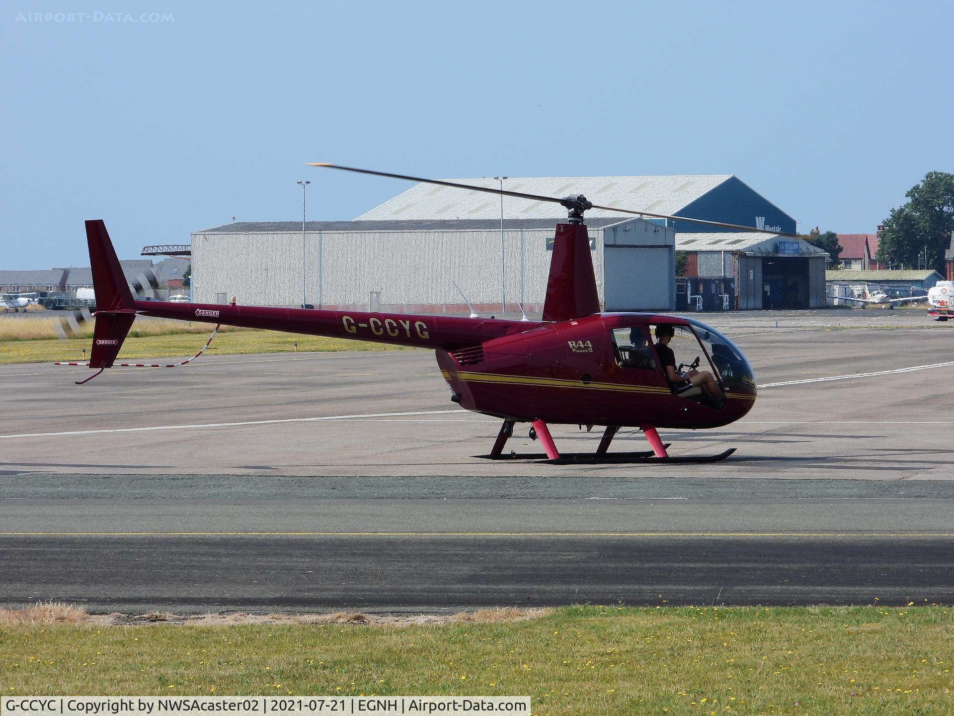 G-CCYC, 2004 Robinson R44 Raven II C/N 10388, Taken at EGNH note the side doors removed due too the hot weather