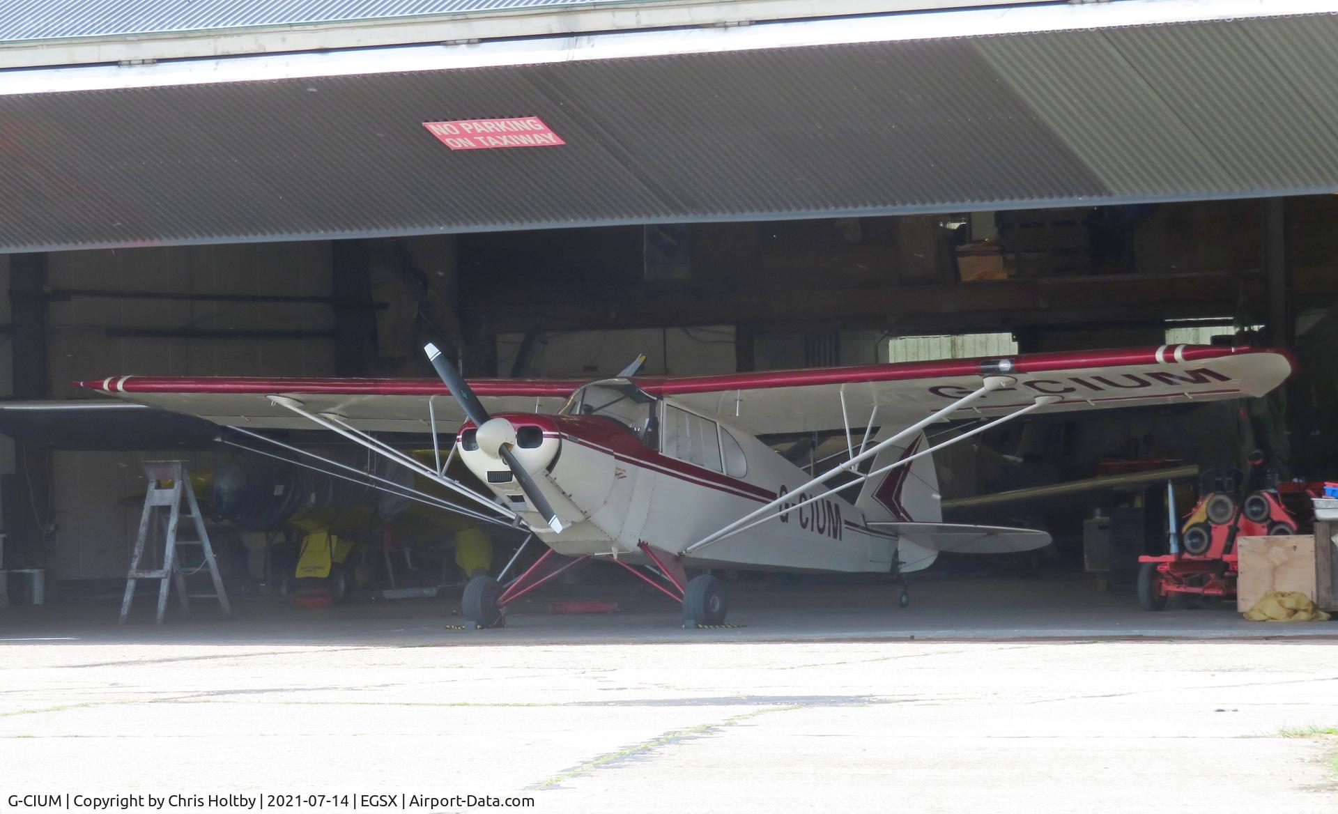 G-CIUM, 1946 Piper PA-12 Super Cruiser C/N 12-1272, Safely stored in the hangar at North Weald.