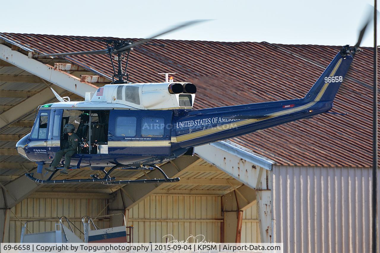 69-6658, 1969 Bell UH-1N Iroquois C/N 31064, air taxing to parking