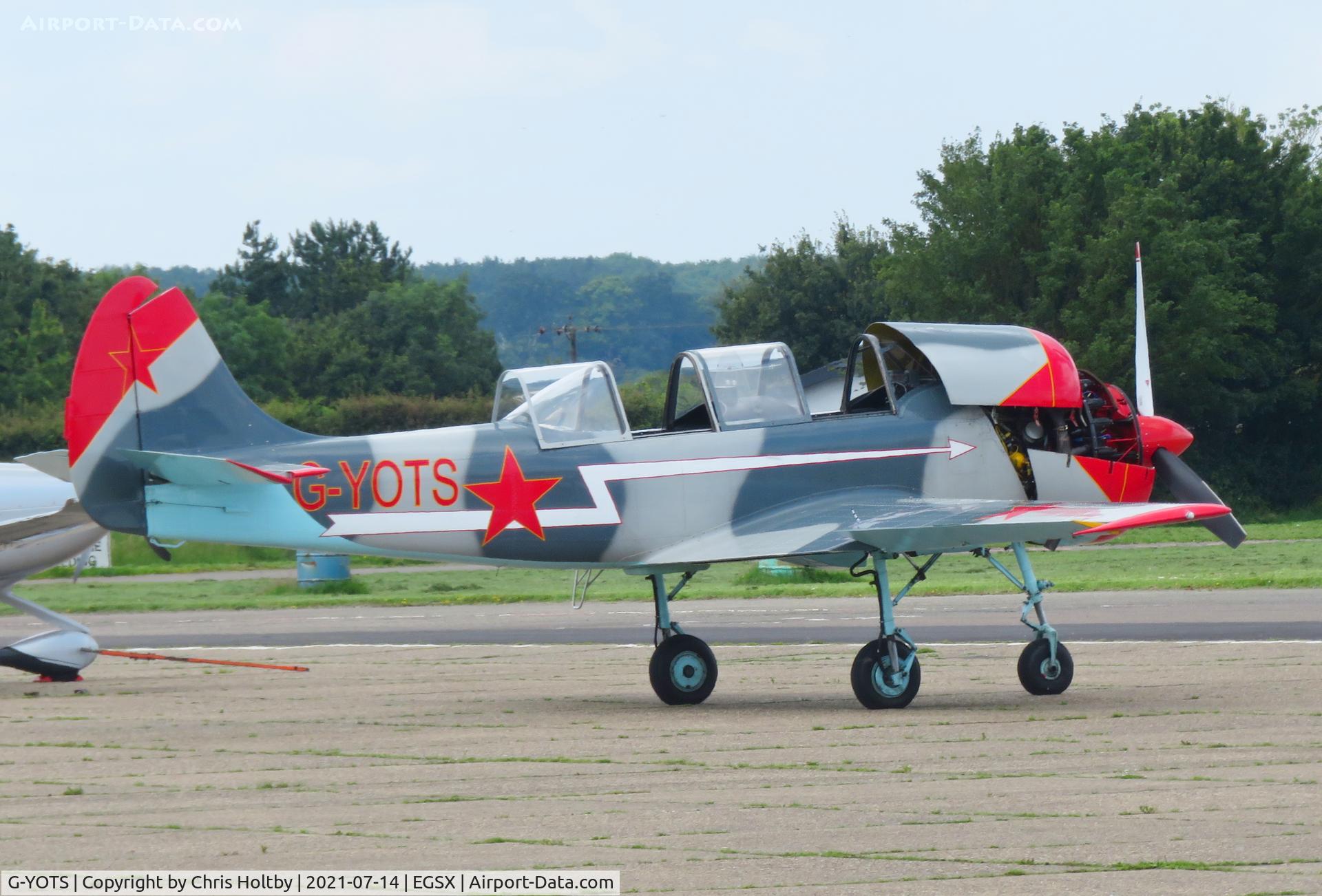 G-YOTS, 1990 Bacau Yak-52 C/N 9010308, Yak-52 being worked on at its base at North Weald